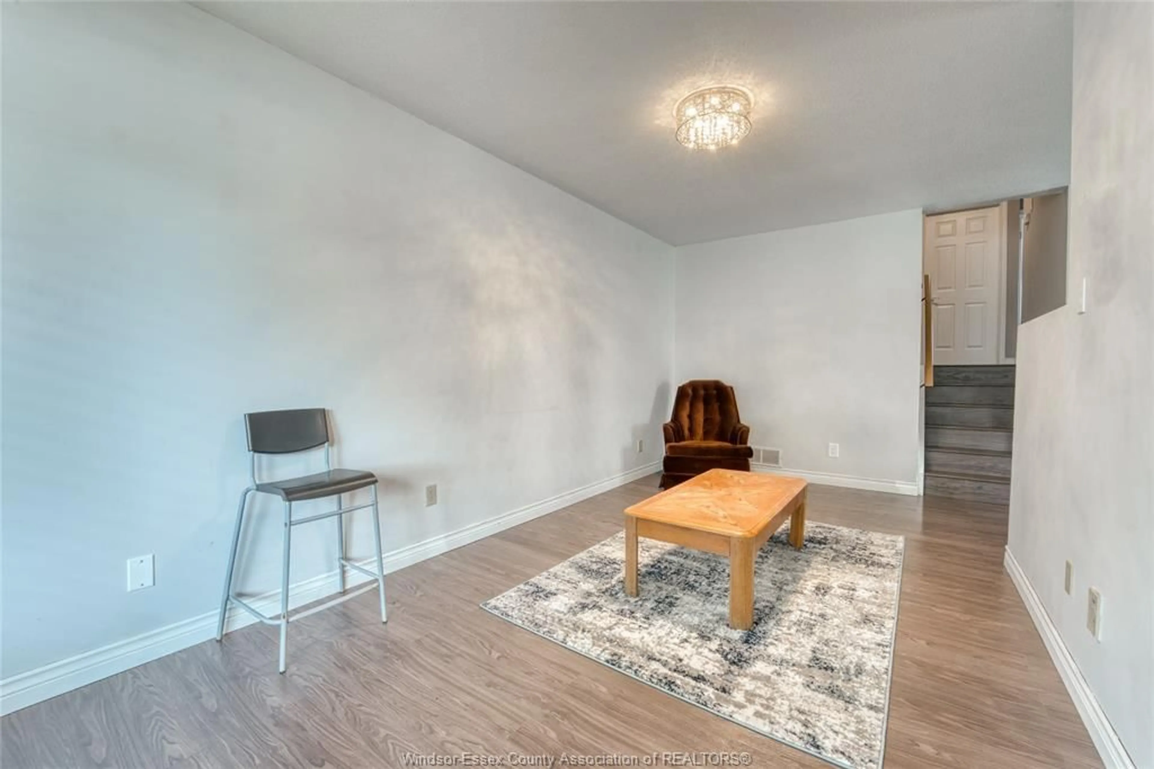 Living room with furniture, wood/laminate floor for 1329 FOSTER Ave, Windsor Ontario N8W 5P3