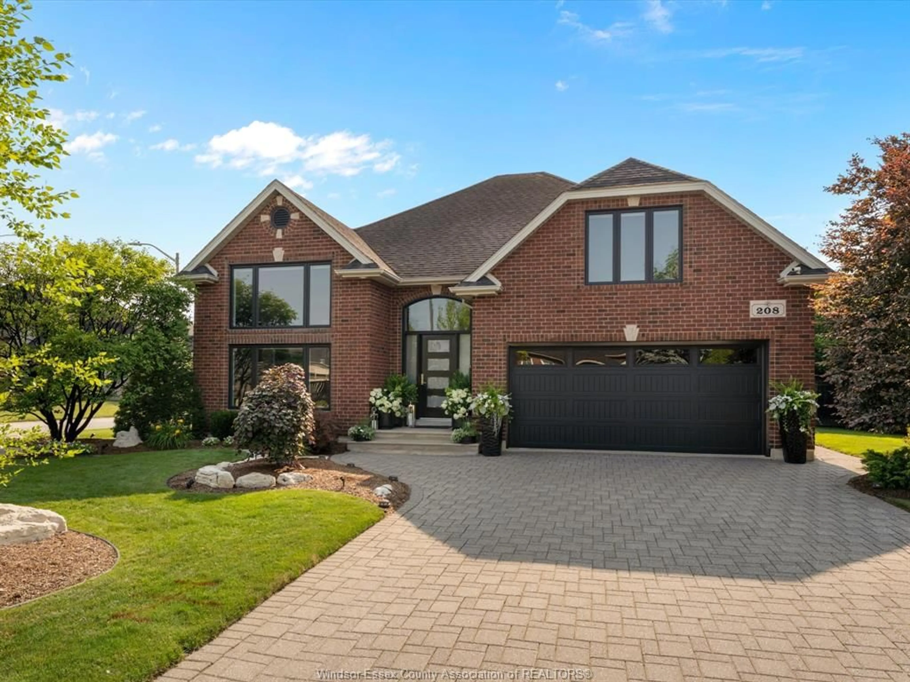Home with brick exterior material, street for 208 LAURENDALE Dr, Lakeshore Ontario N8N 5C3