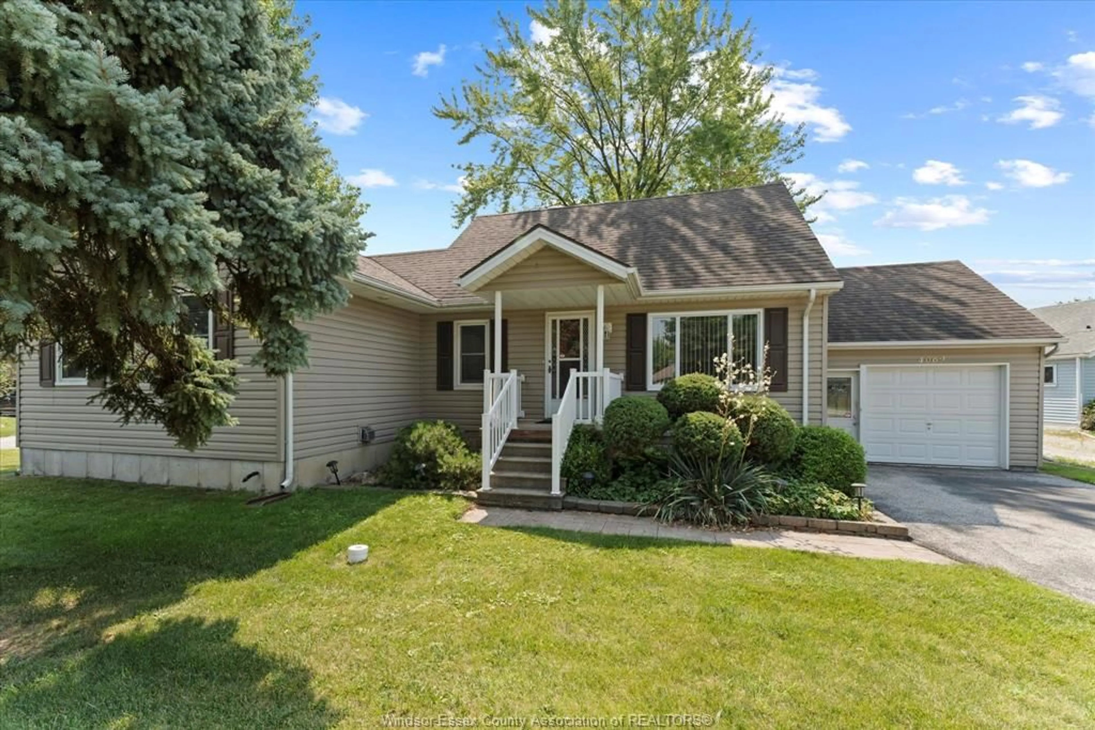 Home with vinyl exterior material, street for 4069 GRAND MARAIS, Windsor Ontario N8W 1W9