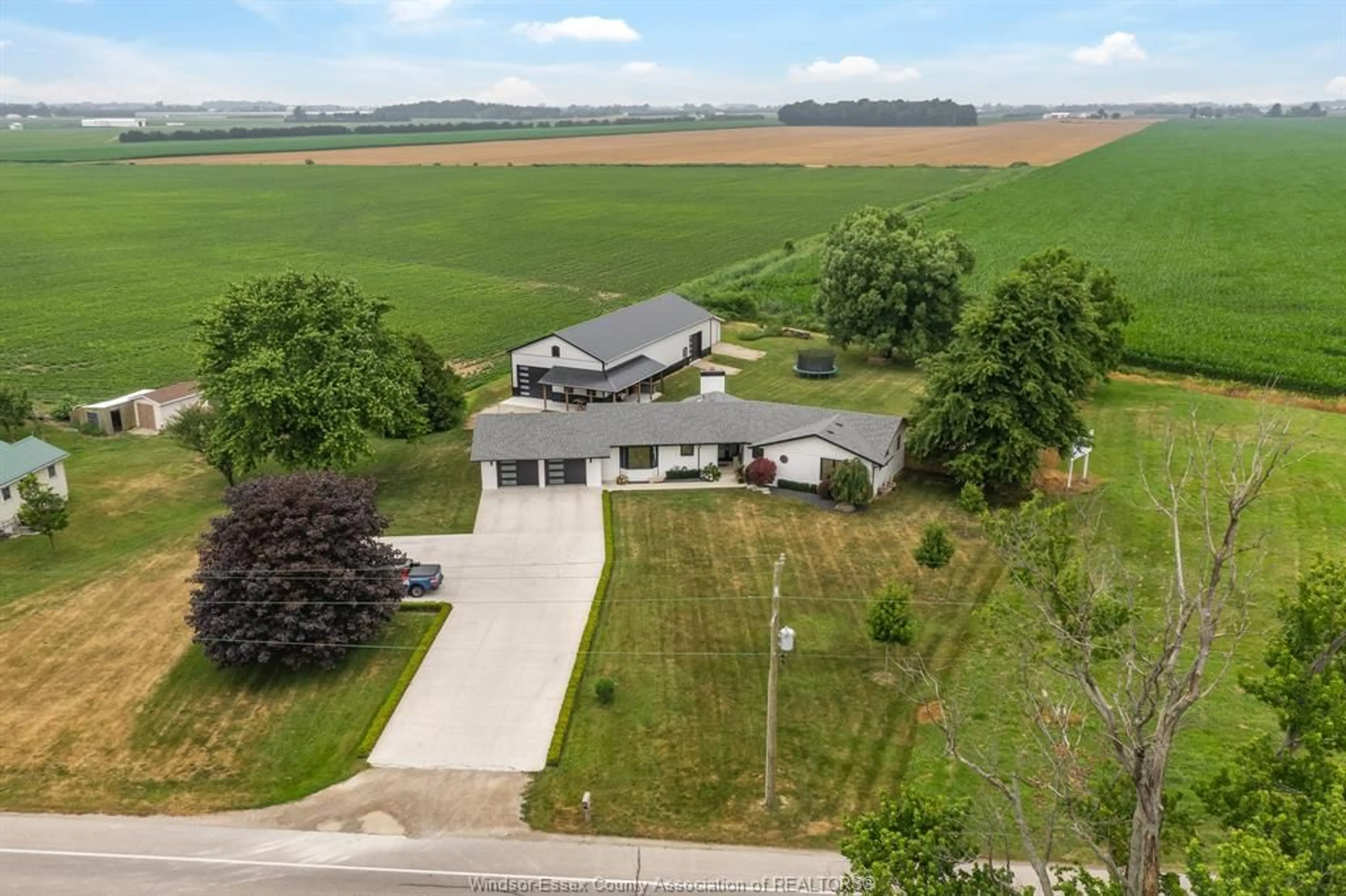 A pic from outside/outdoor area/front of a property/back of a property/a pic from drone, unknown for 429 HIGHWAY 3 E, Leamington Ontario N8H 3V6