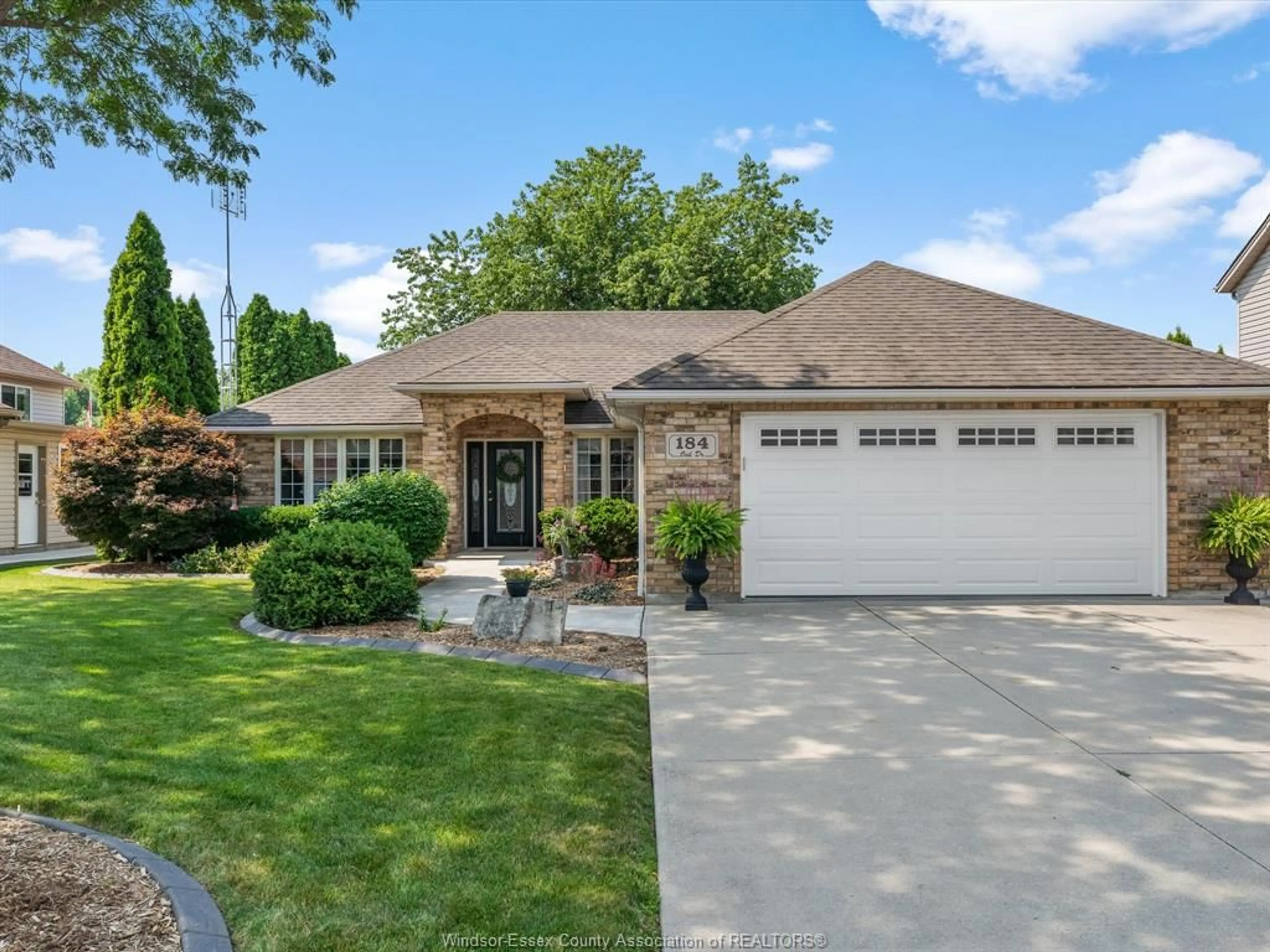 Home with brick exterior material, street for 184 OAK Dr, Essex Ontario N8M 3C6