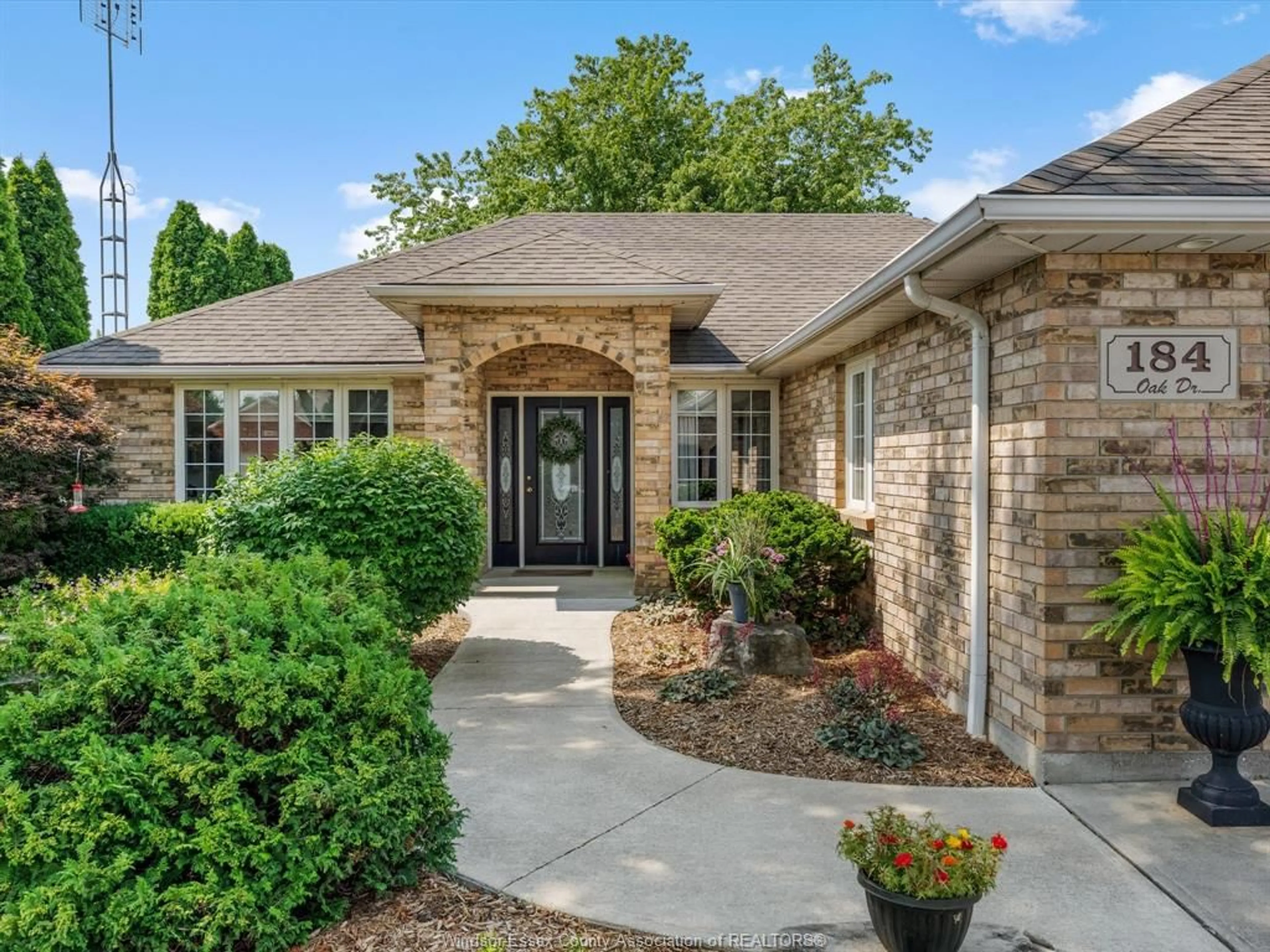 Home with brick exterior material, street for 184 OAK Dr, Essex Ontario N8M 3C6
