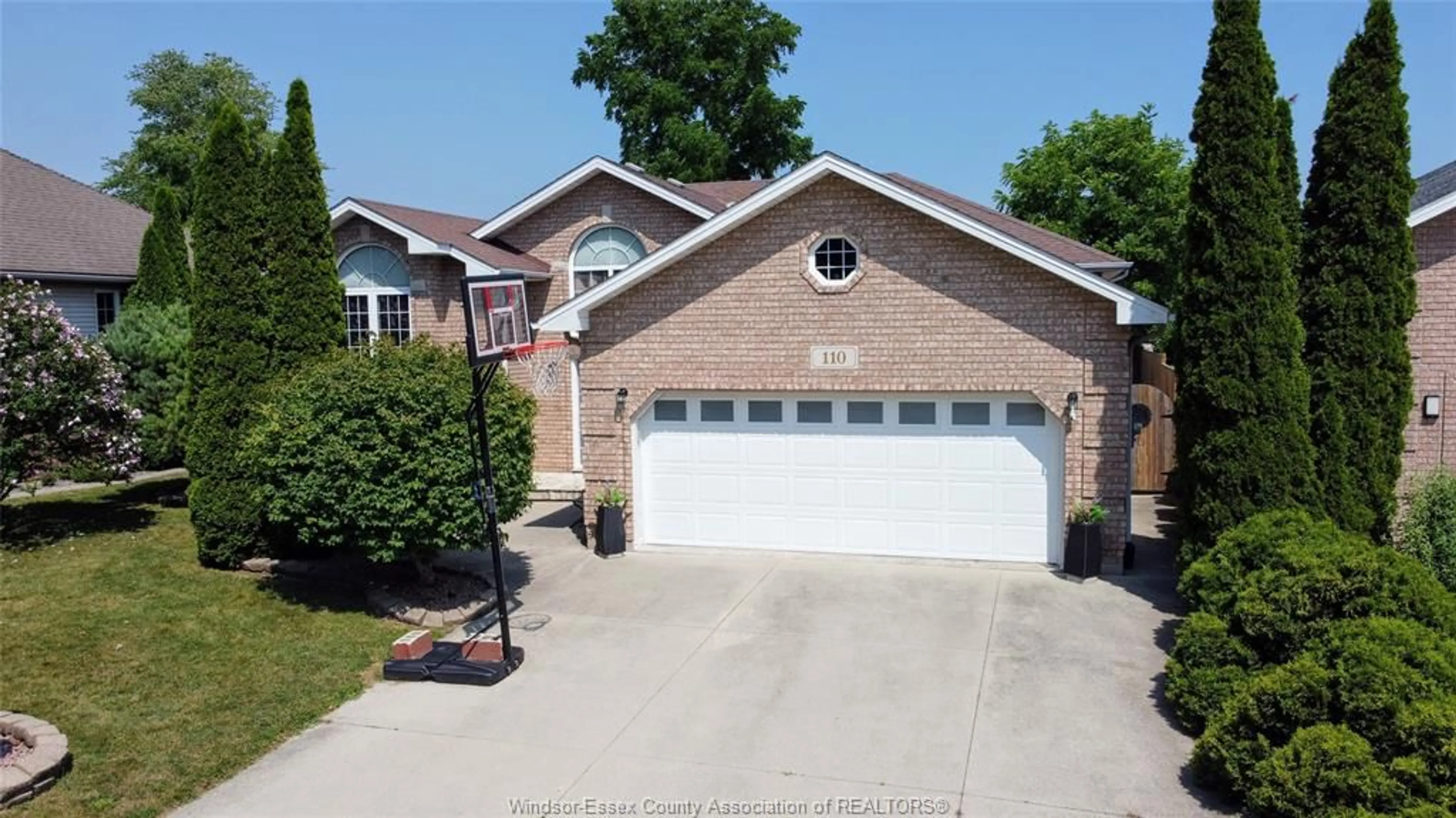 Home with brick exterior material, street for 110 Sunset Dr, Harrow Ontario N0R 1G0