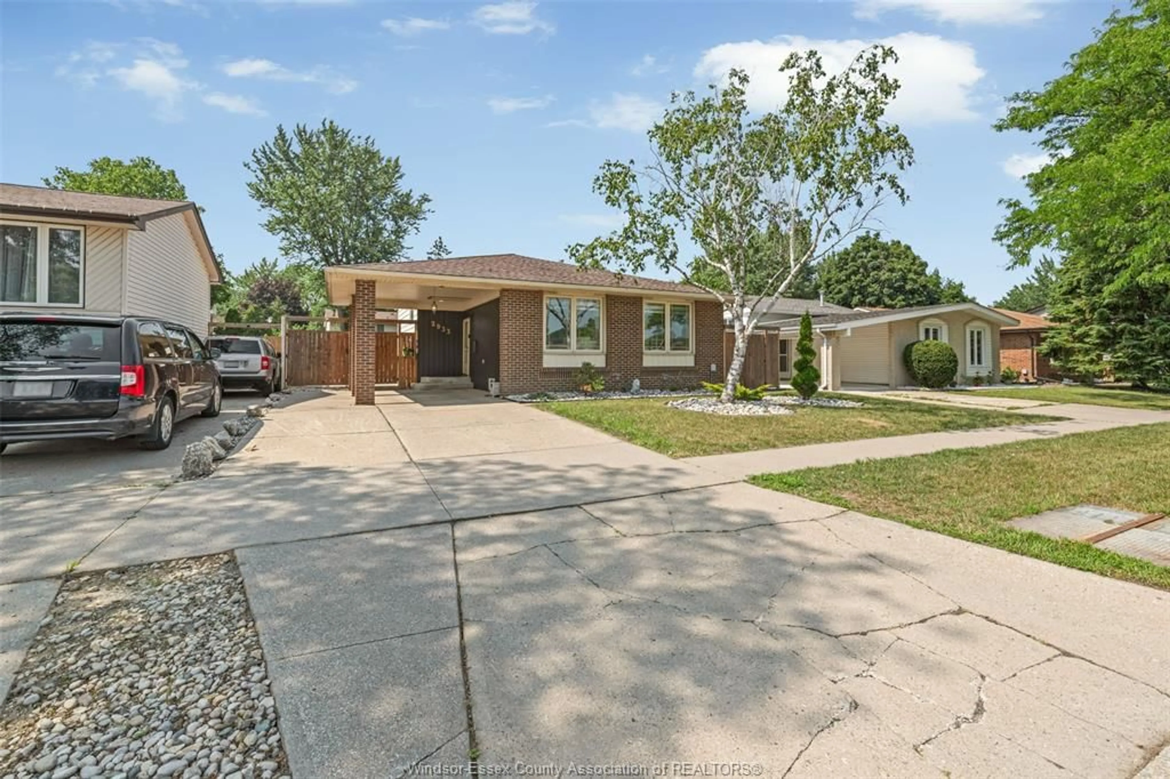 Home with brick exterior material, street for 2933 WILDWOOD Dr, Windsor Ontario N8R 1T9