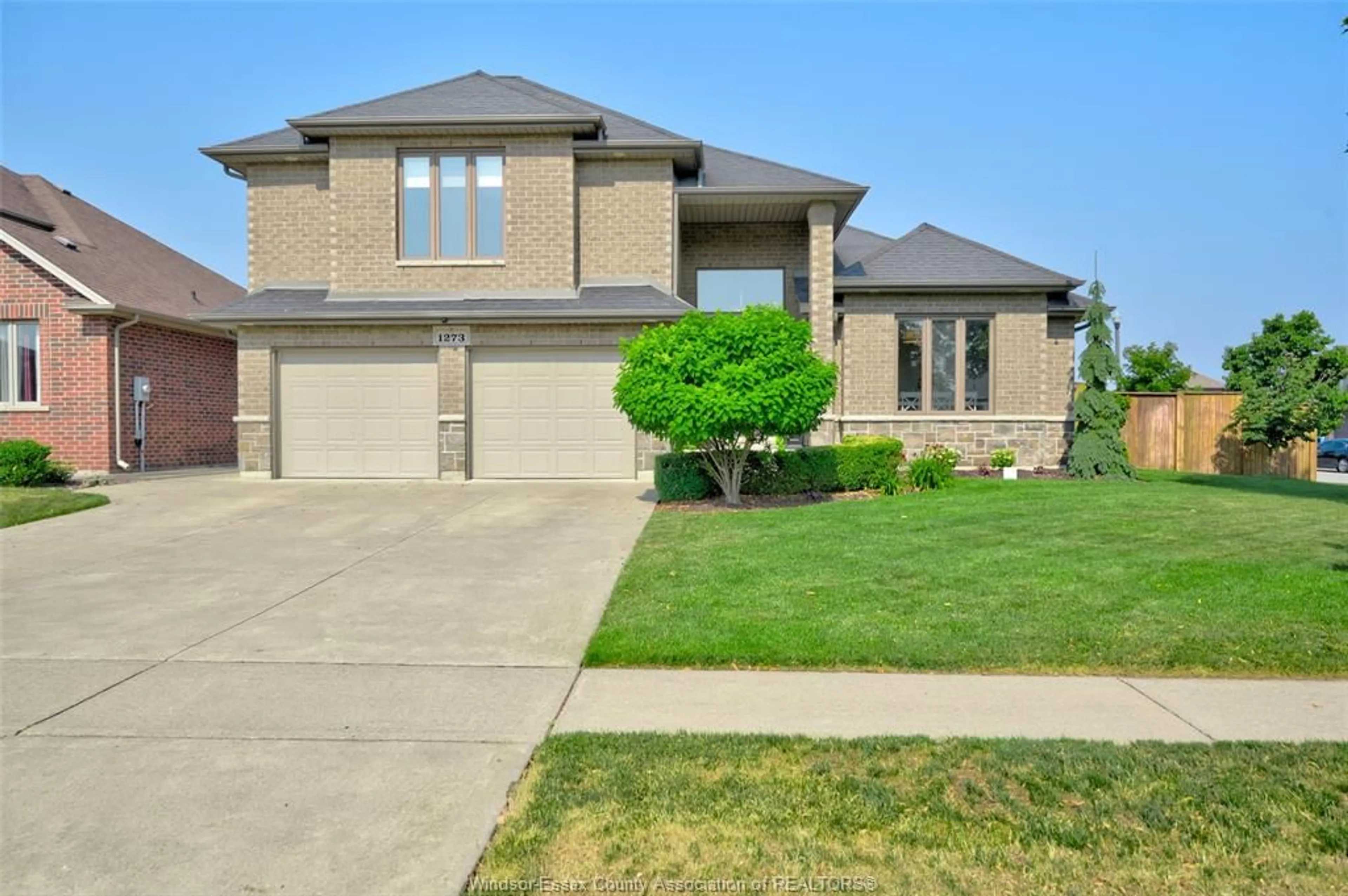 Home with brick exterior material, street for 1273 DEER RUN Trail, Lakeshore Ontario N8L 0S8