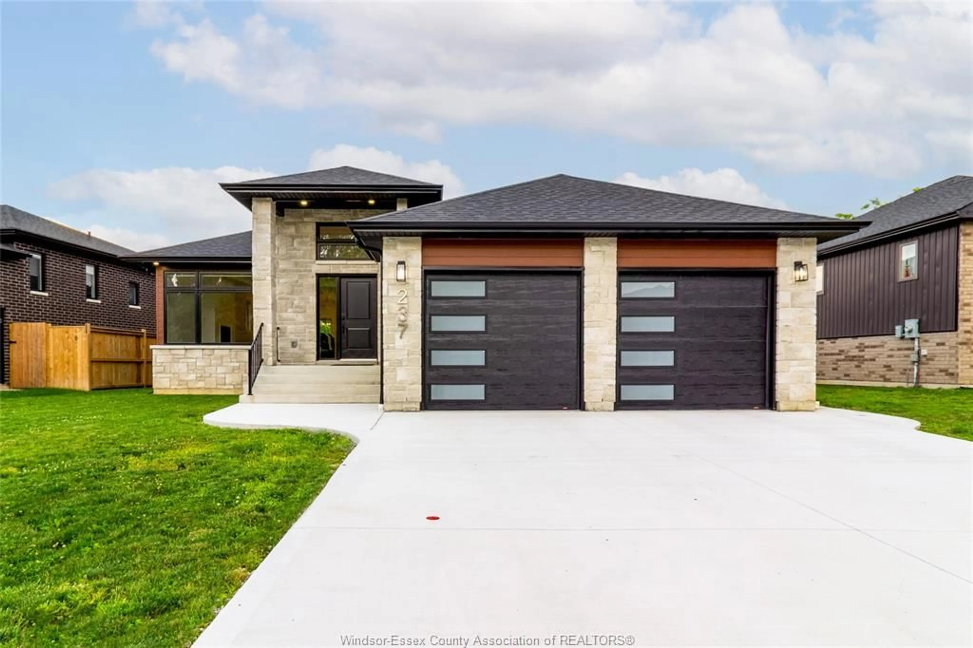 Home with brick exterior material, street for 237 SANDYBROOK Way, Kingsville Ontario N9Y 0A3