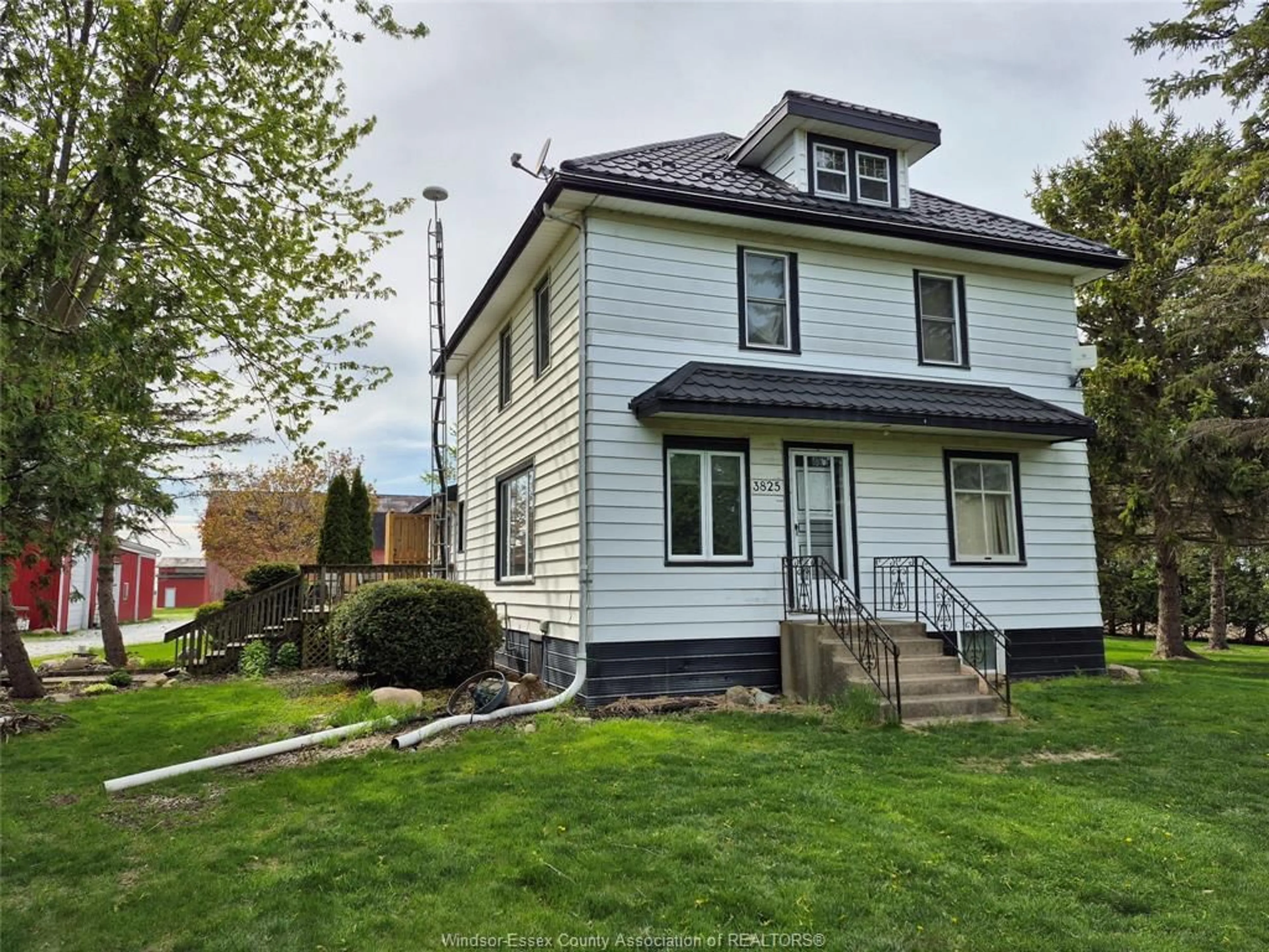 Home with vinyl exterior material, street for 3825 Comber Sideroad, Lakeshore Ontario N0R 1N0