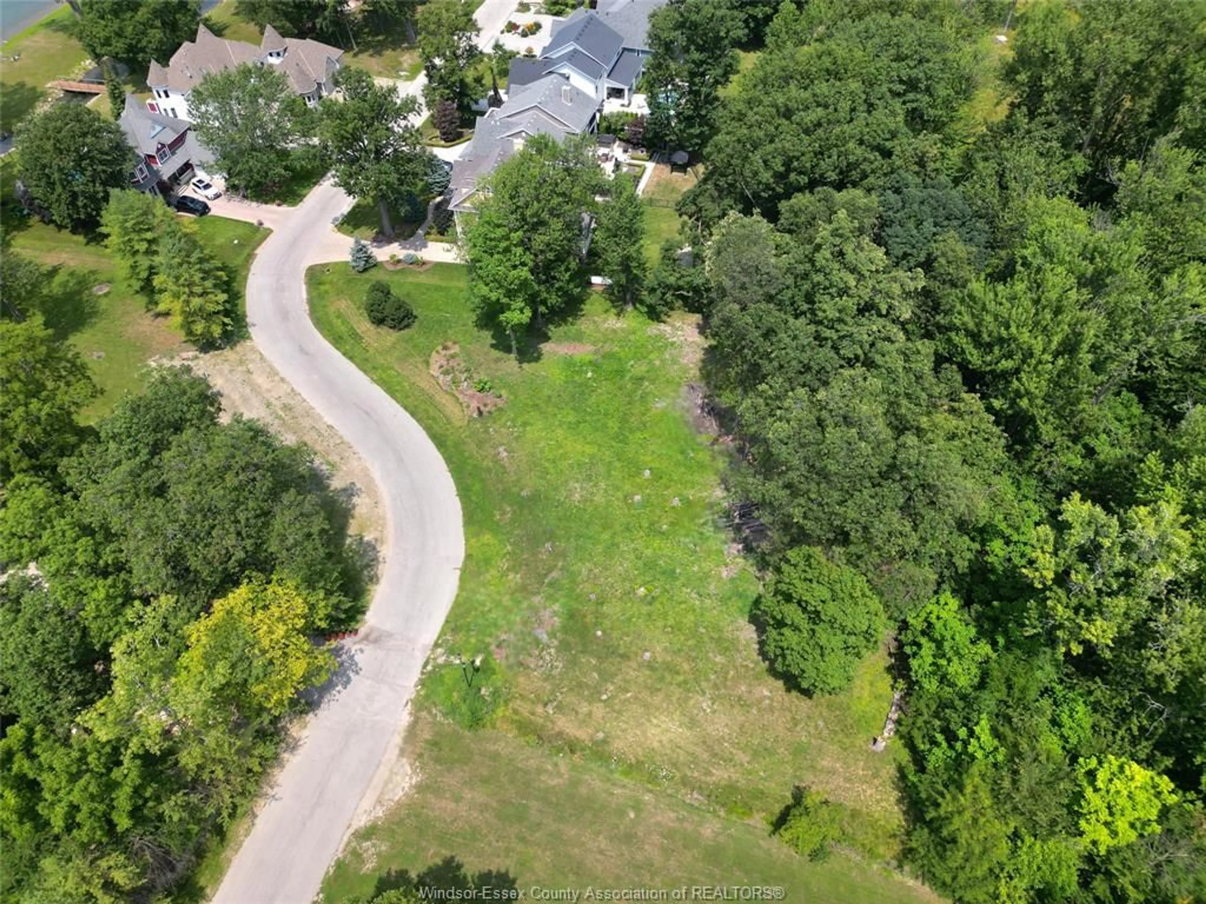 A pic from outside/outdoor area/front of a property/back of a property/a pic from drone, forest/trees view for 271 CRYSTAL BAY, Amherstburg Ontario N9V 4A6