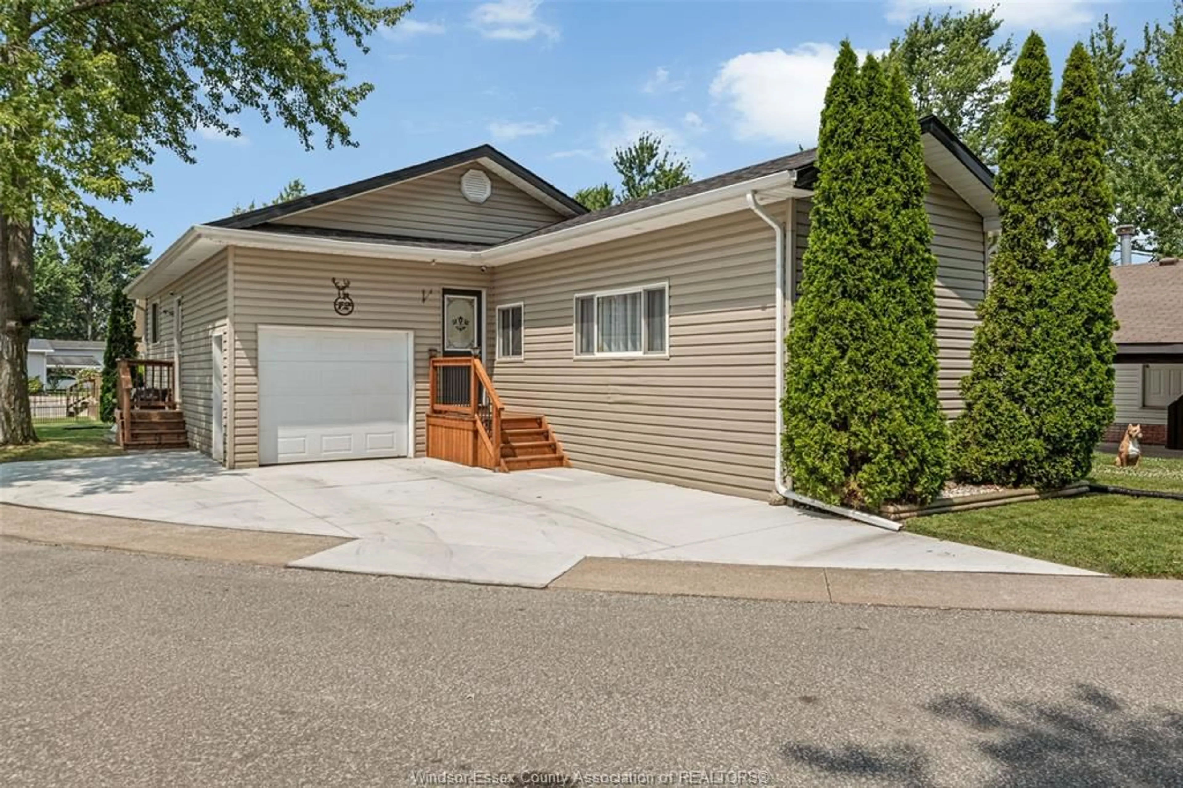 Home with vinyl exterior material, street for 12 SPRUCE ST, McGregor Ontario N0R 1J0