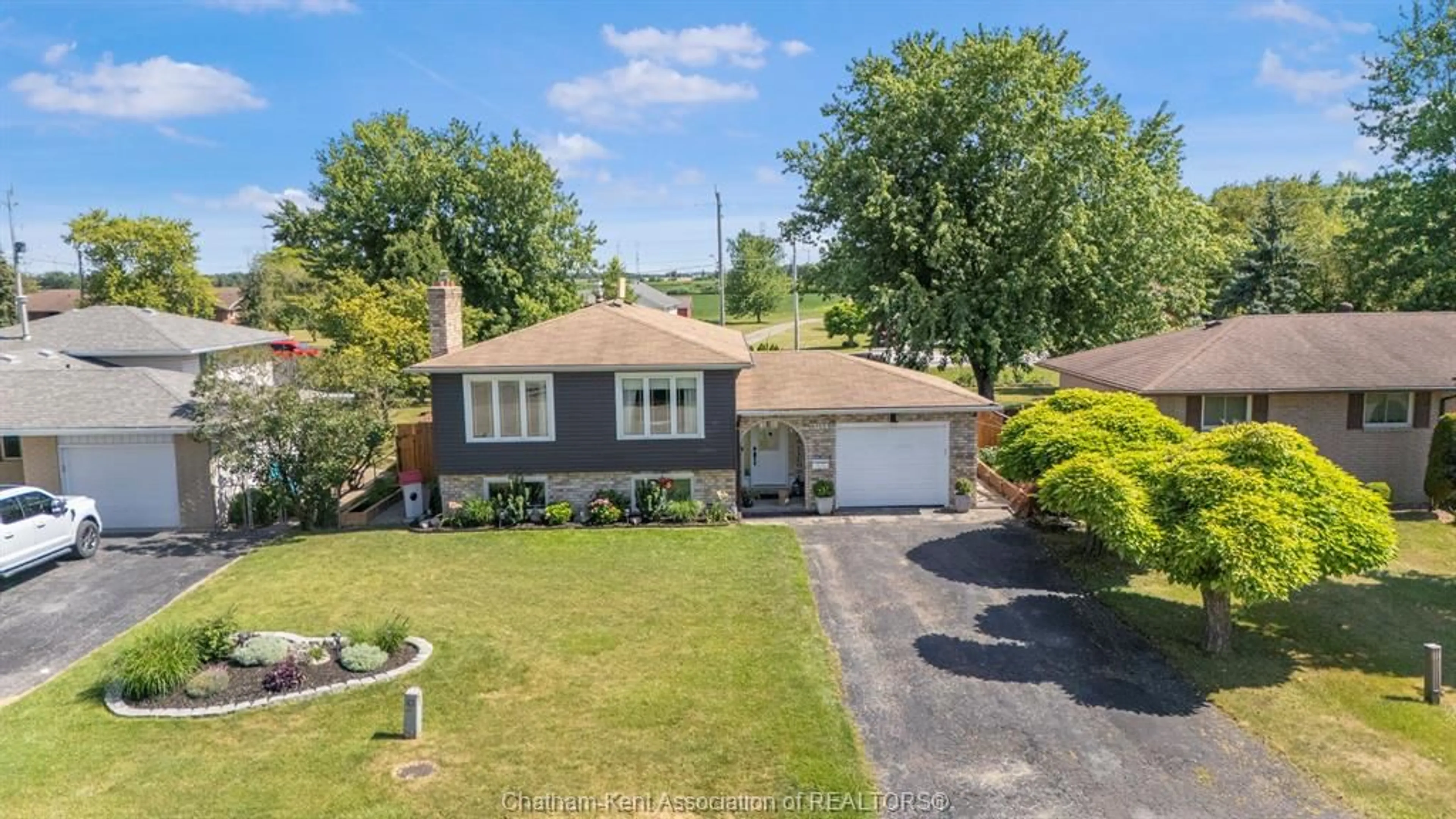 A pic from outside/outdoor area/front of a property/back of a property/a pic from drone, street for 7139 William St, Comber Ontario N0J 1P0