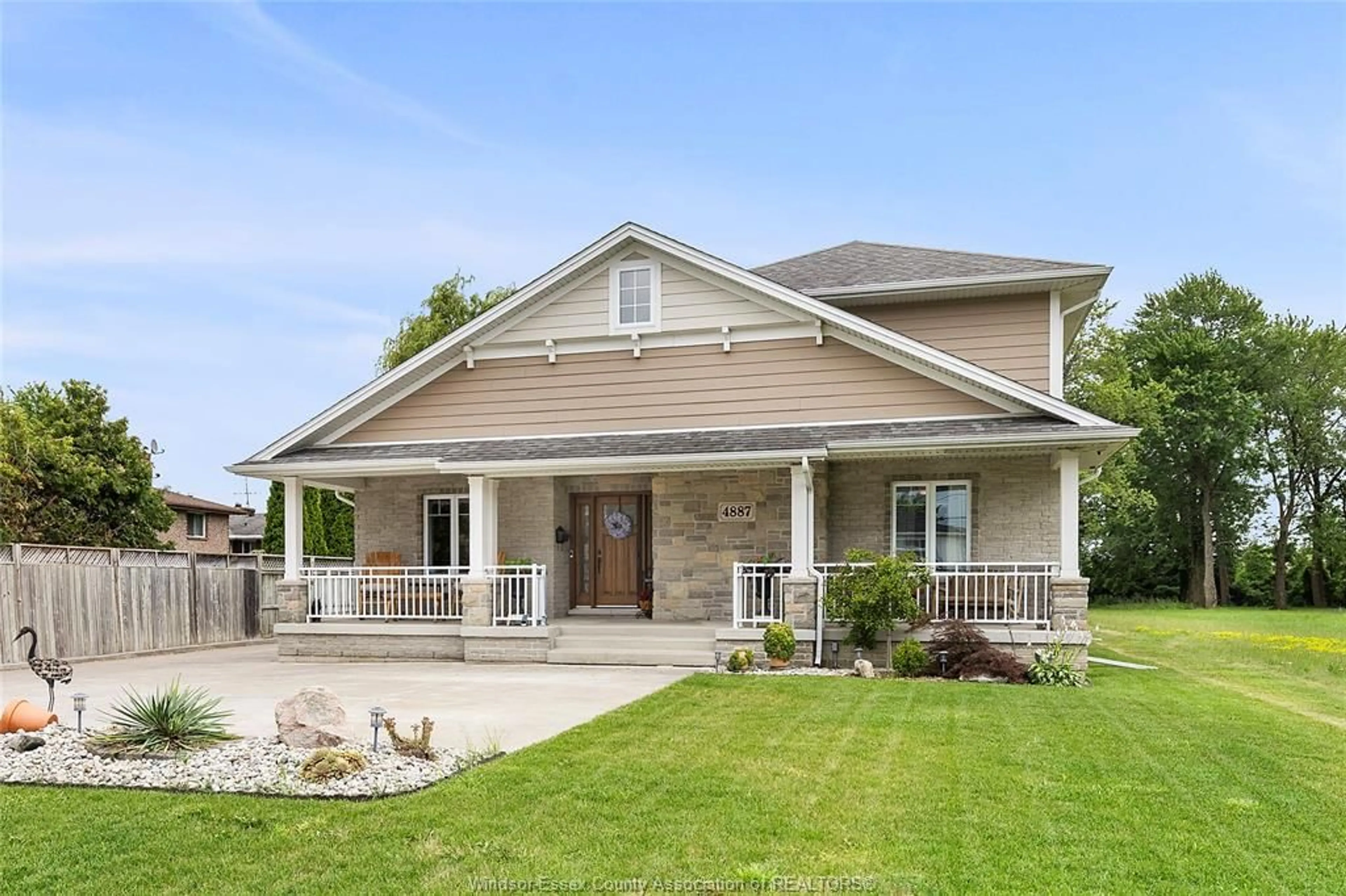 Home with vinyl exterior material, street for 4887 GRAND Blvd, Windsor Ontario N8T 0A2