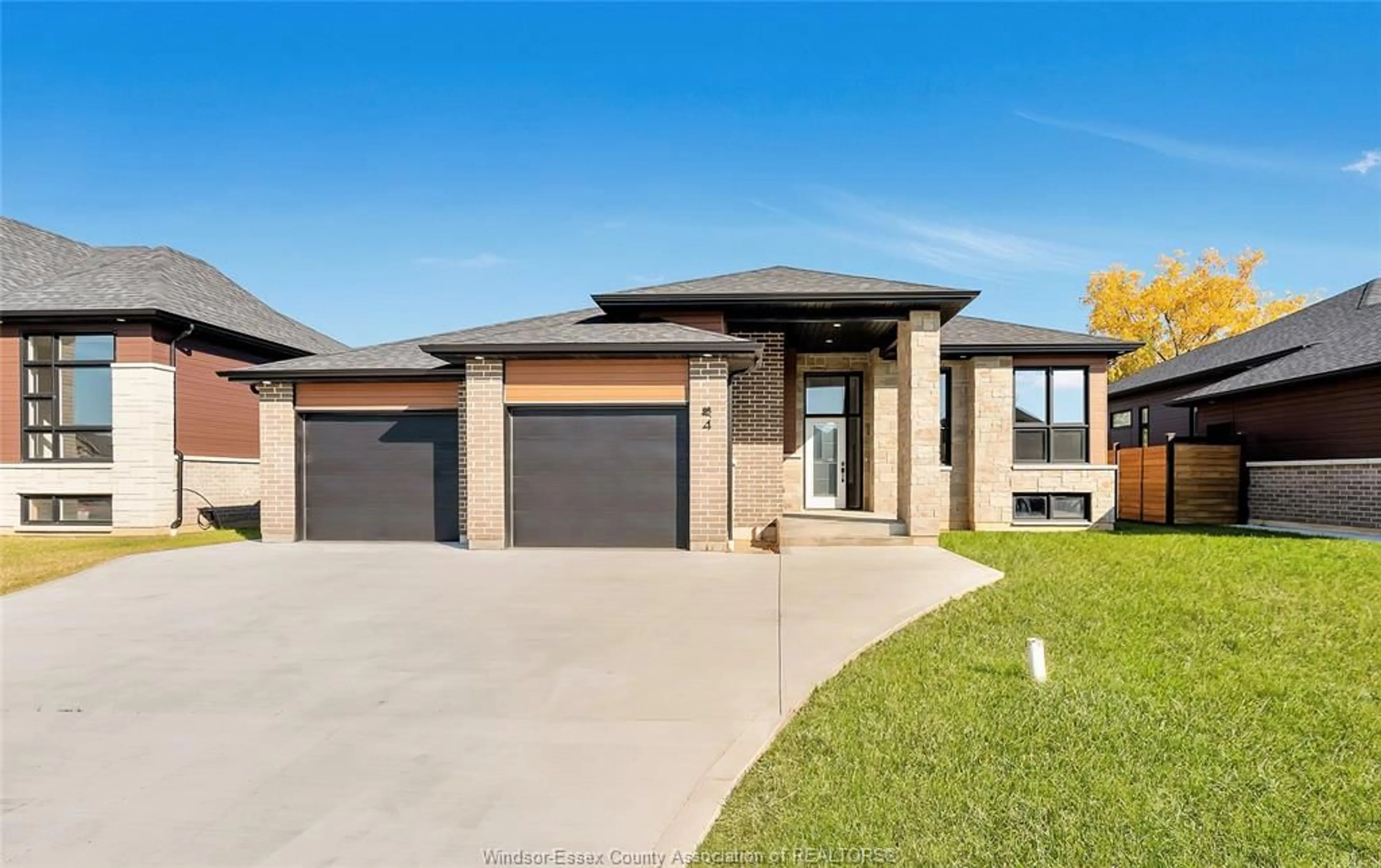 Home with brick exterior material, street for 4 WOODLAND, Kingsville Ontario N9Y 0A9