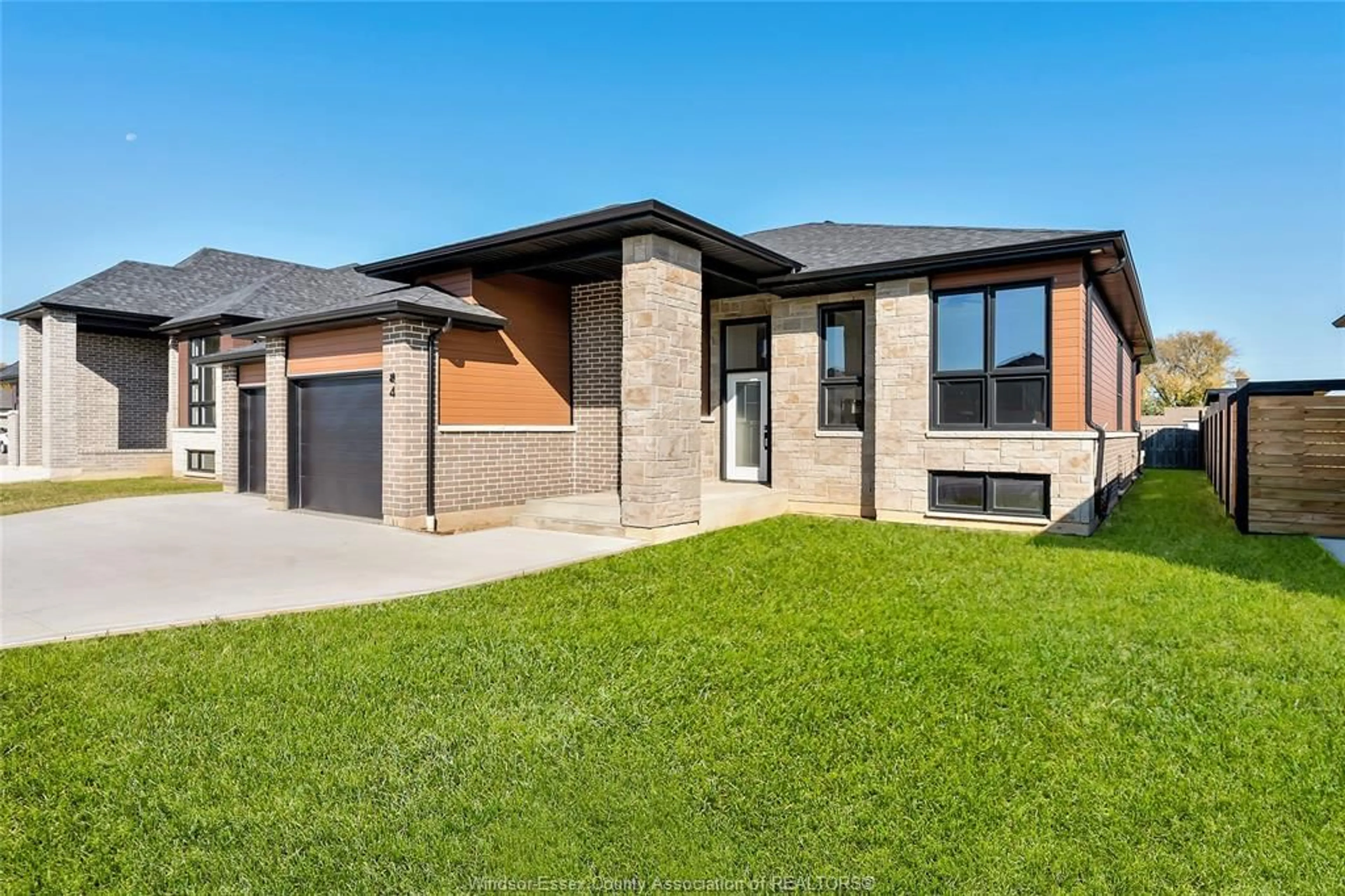 Home with brick exterior material, street for 4 WOODLAND, Kingsville Ontario N9Y 0A9