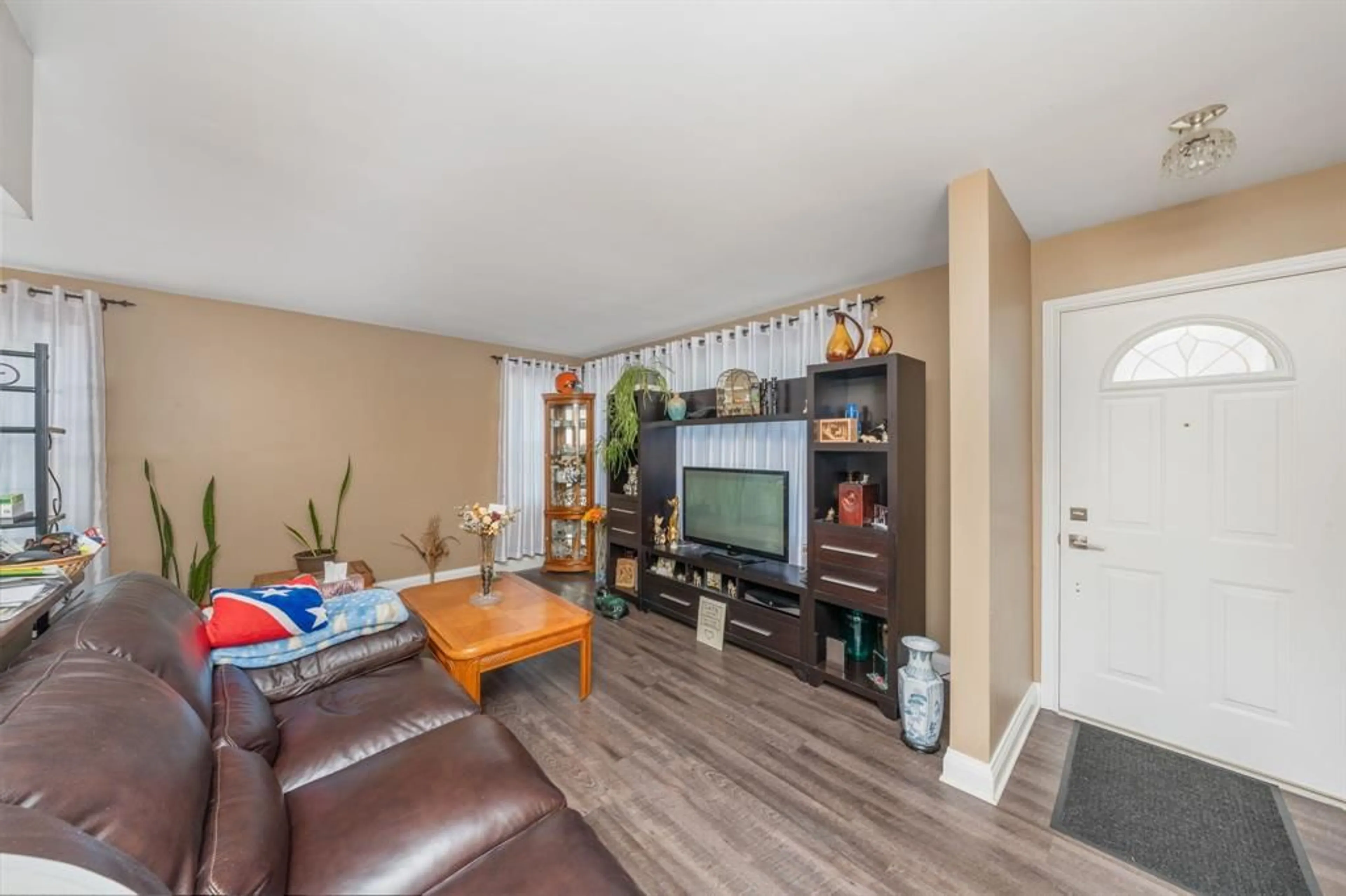 Living room with furniture, wood/laminate floor for 751 KEMSLEY Dr, Sarnia Ontario N7V 2M3