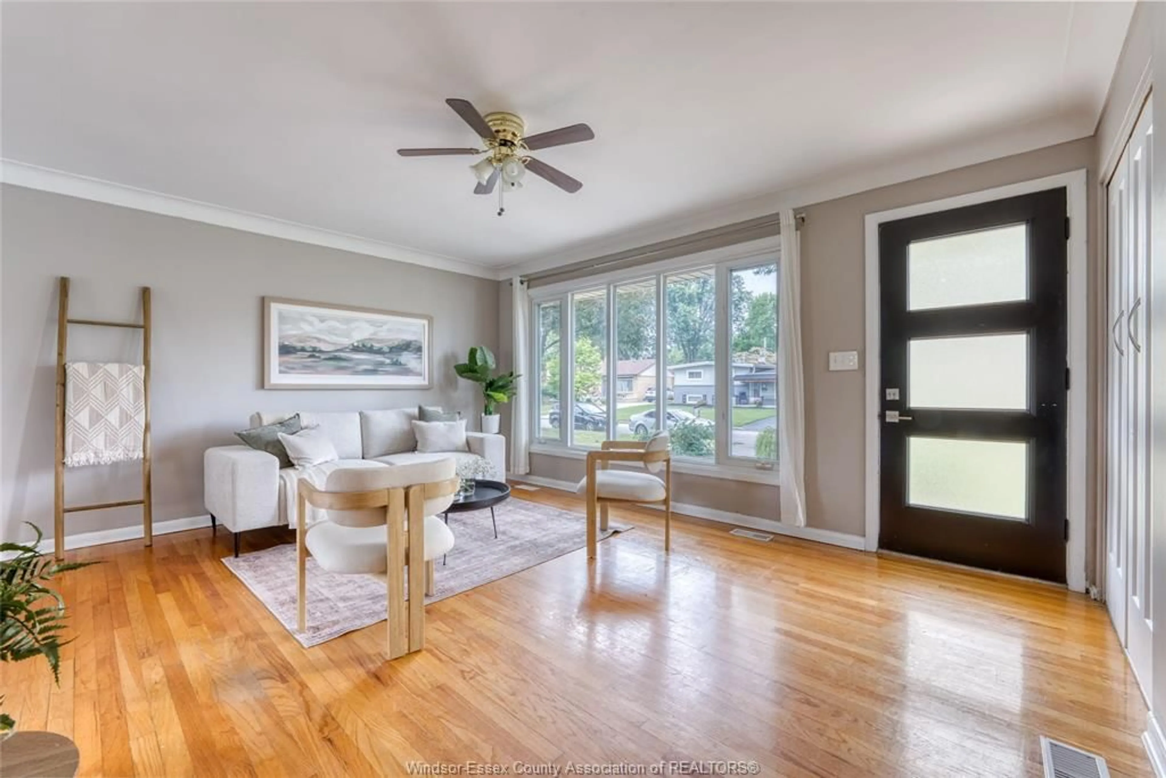 Living room with furniture, wood/laminate floor for 1557 ST. GABRIEL Crt, Windsor Ontario N9E 1N8
