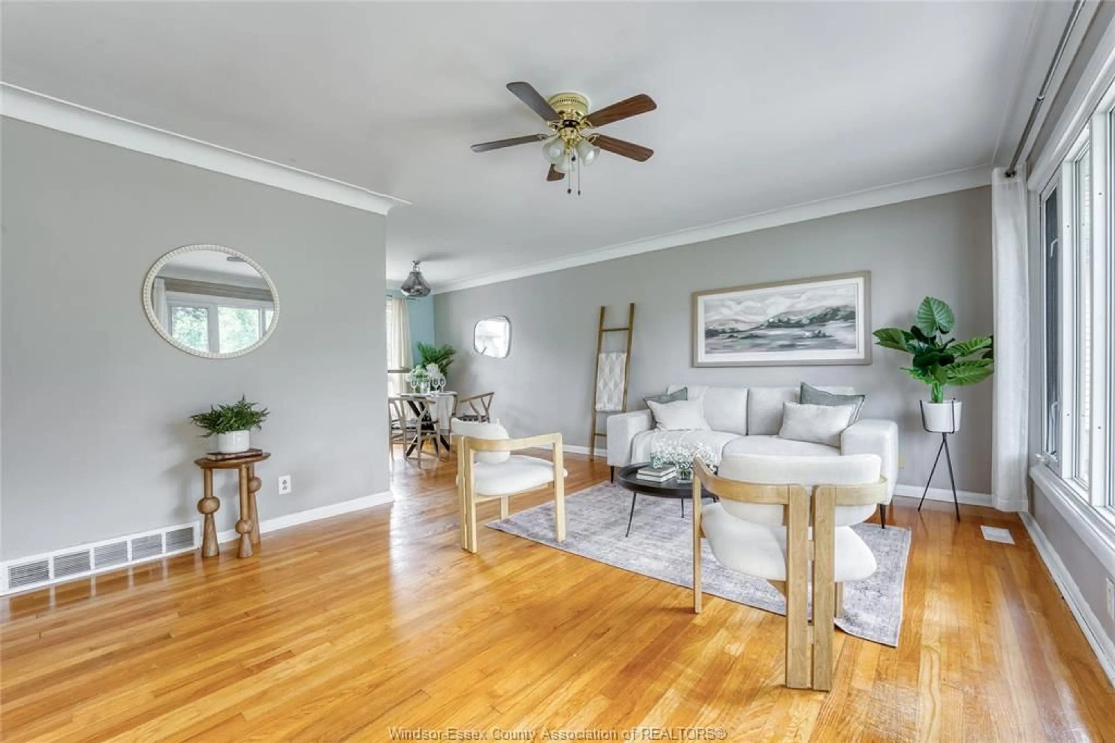 Living room with furniture, wood/laminate floor for 1557 ST. GABRIEL Crt, Windsor Ontario N9E 1N8