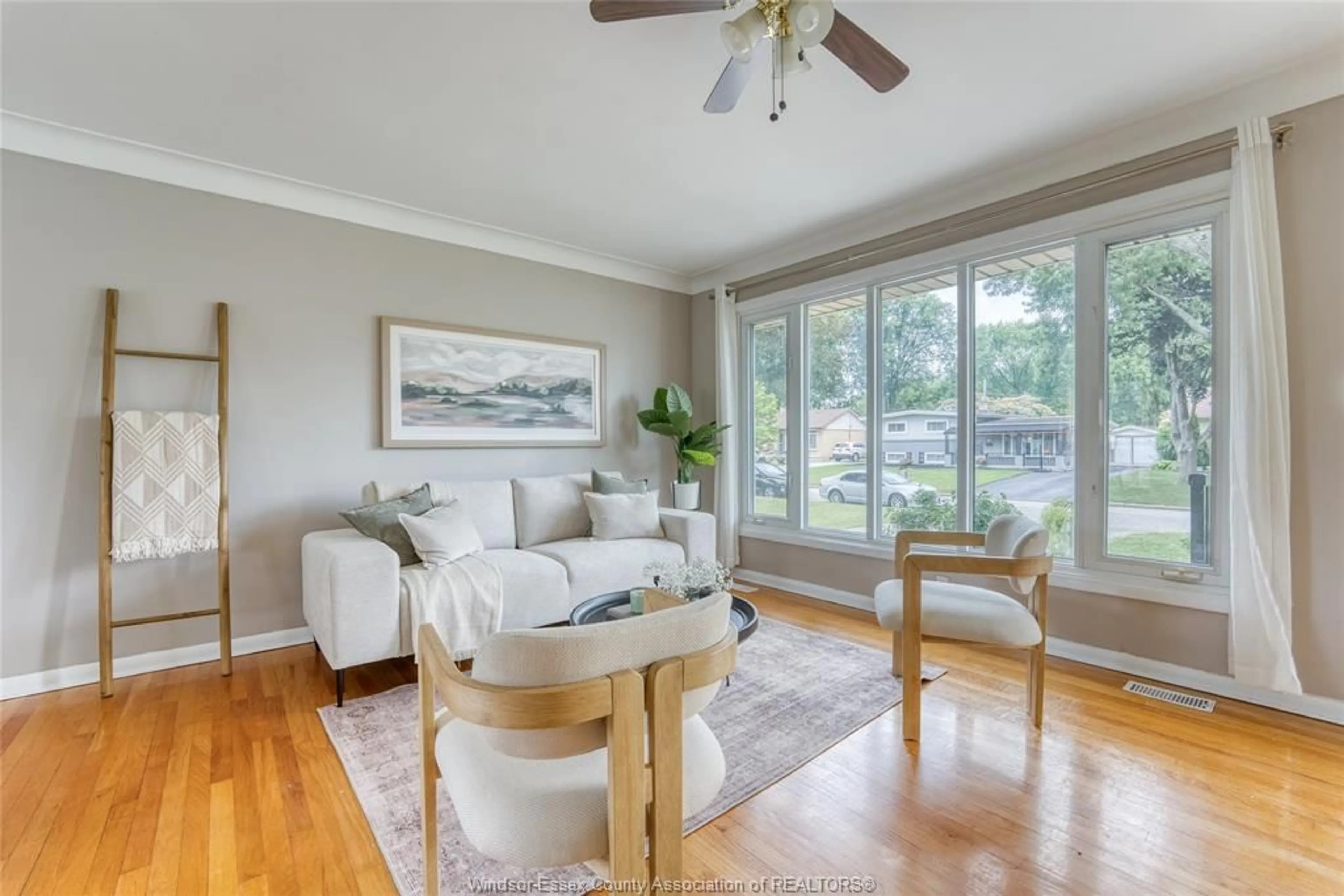 Living room with furniture, wood/laminate floor for 1557 ST. GABRIEL Crt, Windsor Ontario N9E 1N8