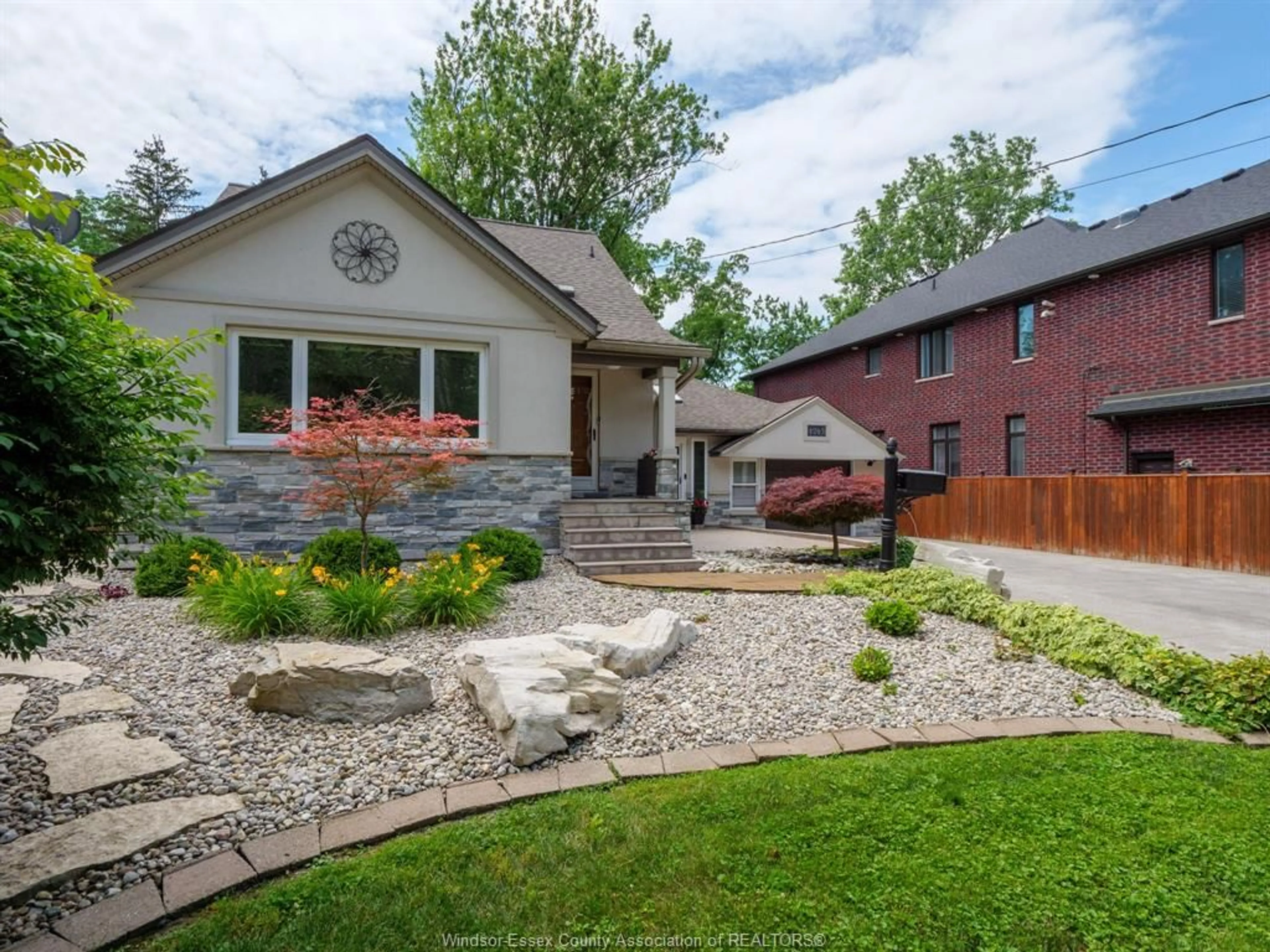 Home with brick exterior material, street for 4245 KENNEDY Dr, Windsor Ontario N9G 1Y1