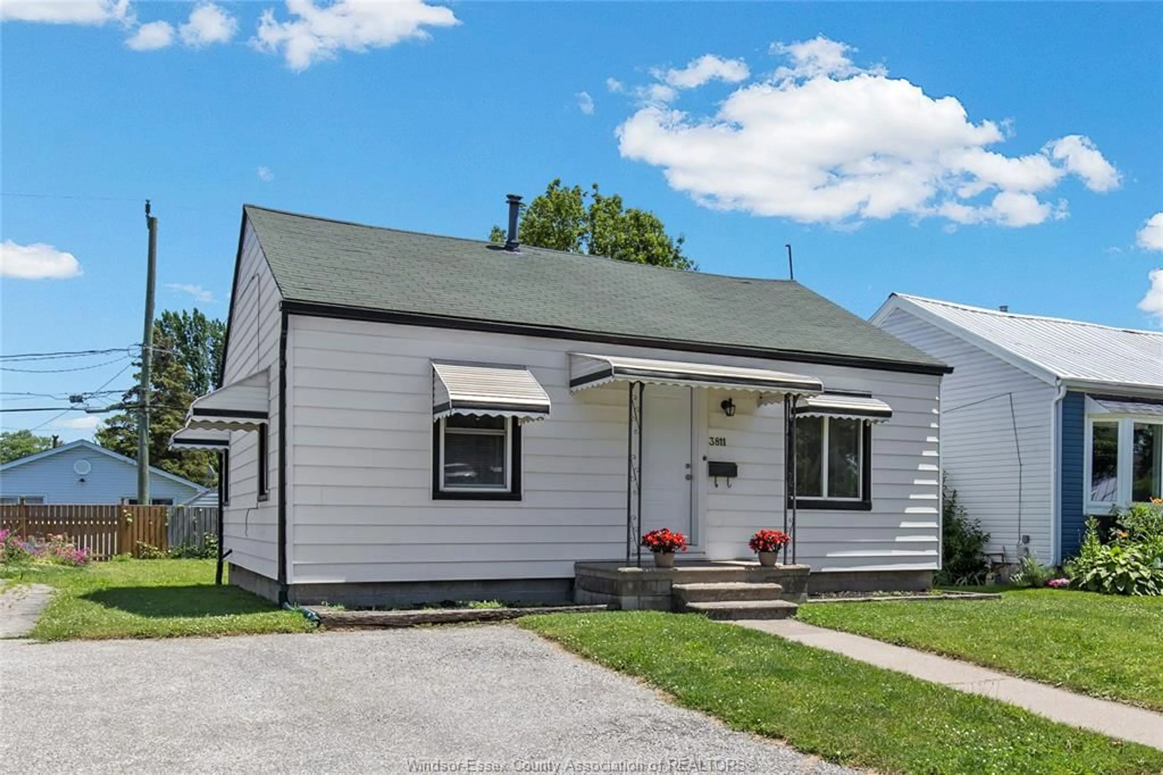 Home with vinyl exterior material, street for 3811 CONNAUGHT, Windsor Ontario N9C 2C2
