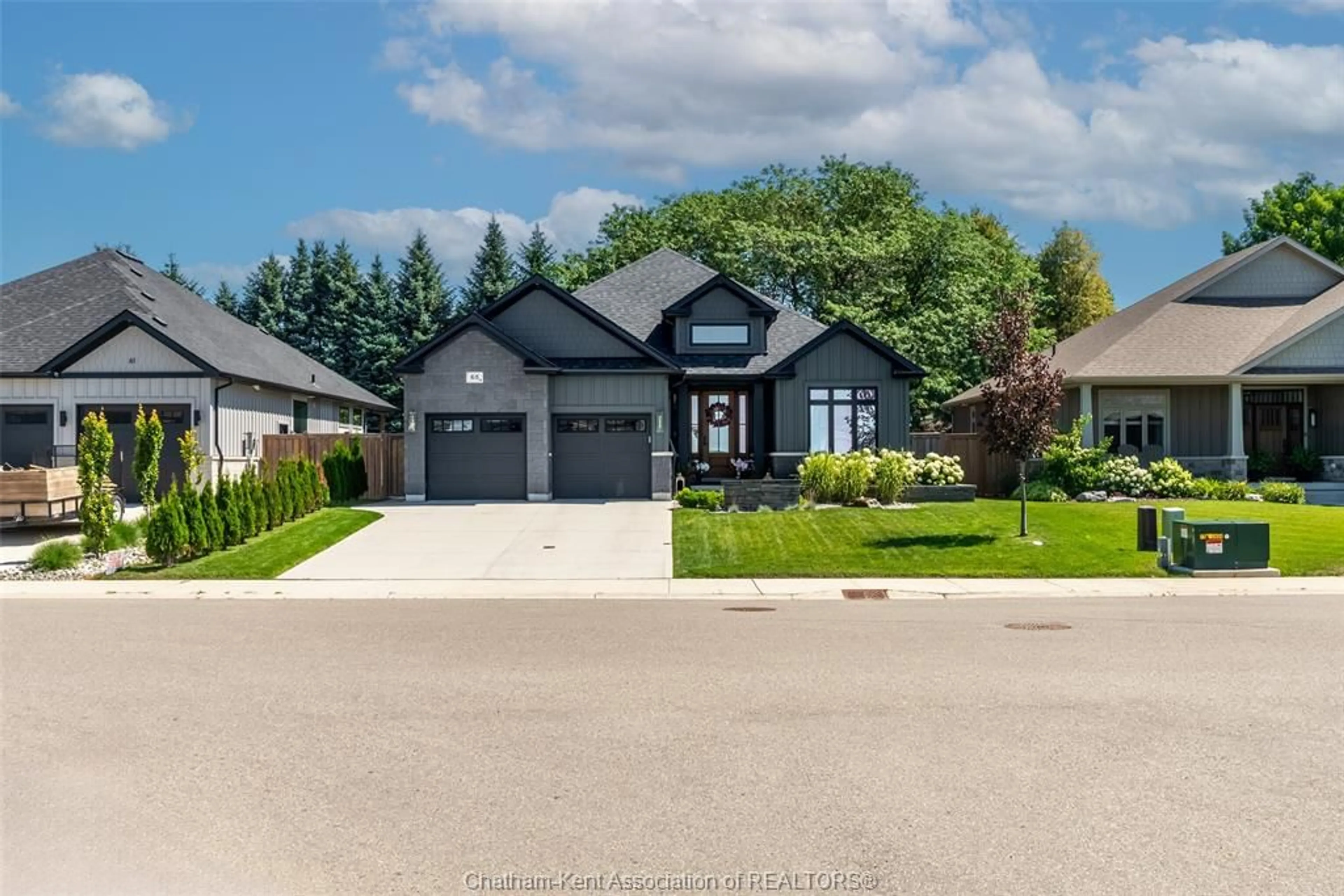 Home with brick exterior material, street for 65 Tuscany Trail, Chatham Ontario N7M 0R9