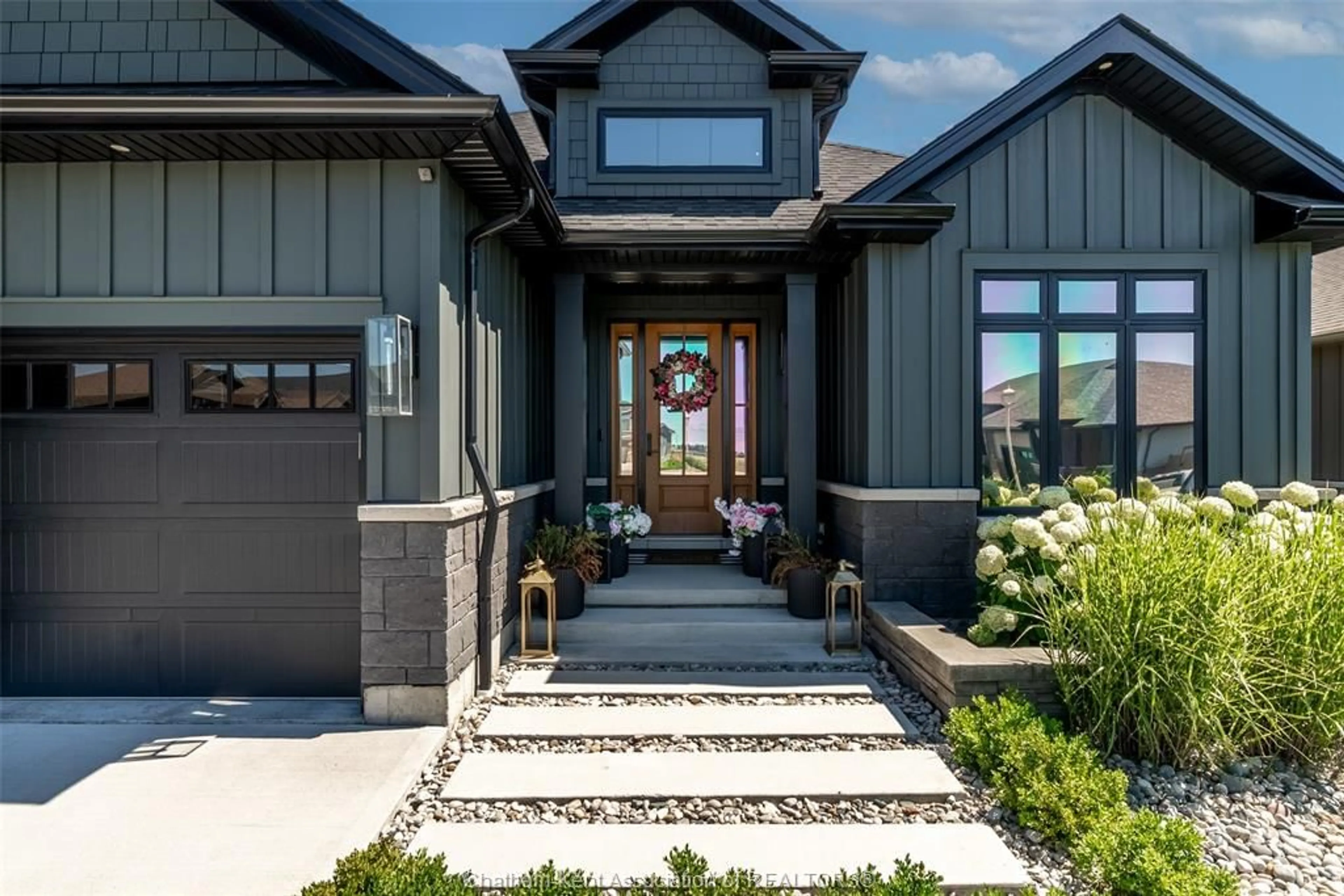 Home with brick exterior material, street for 65 Tuscany Trail, Chatham Ontario N7M 0R9