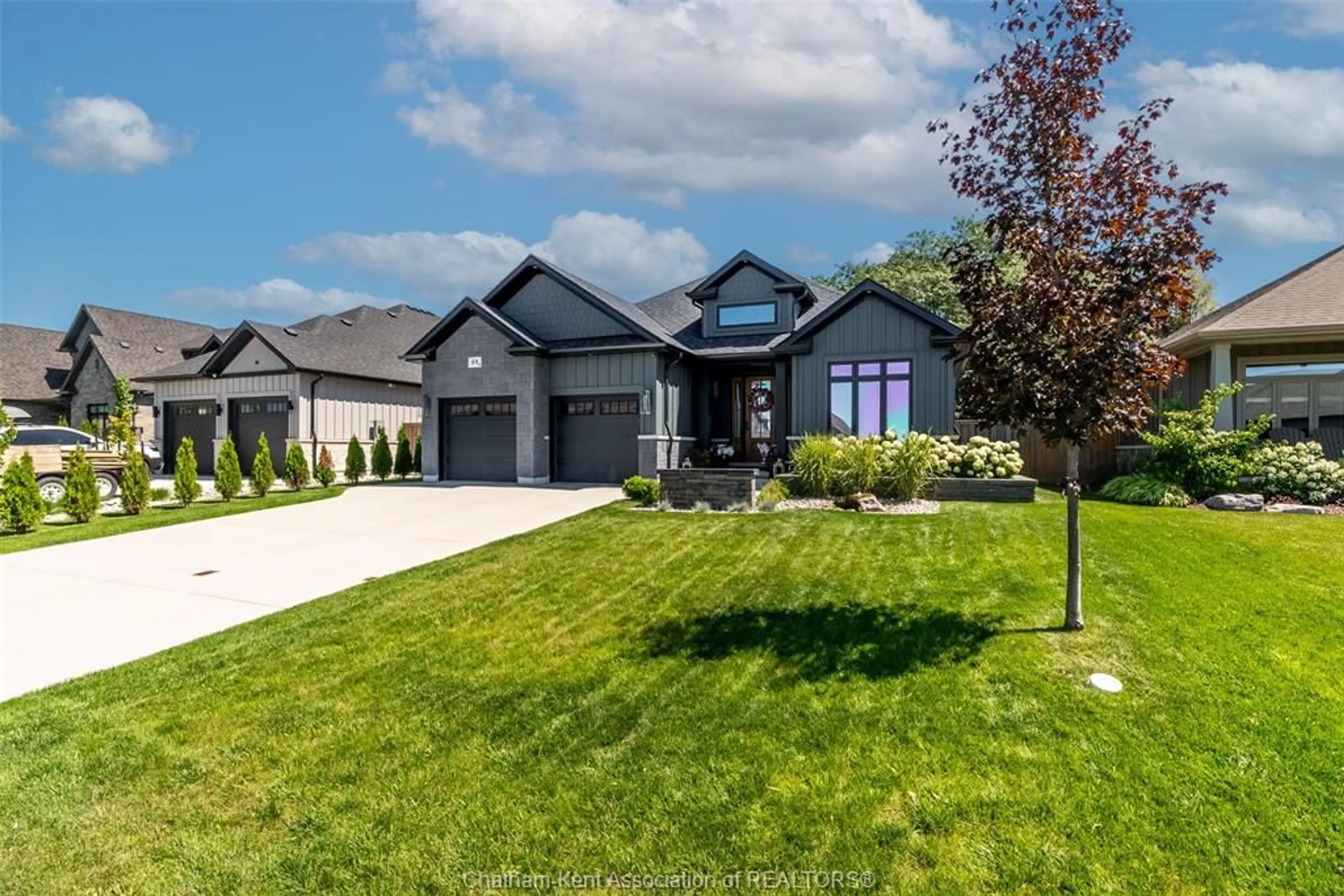 Home with brick exterior material, street for 65 Tuscany Trail, Chatham Ontario N7M 0R9