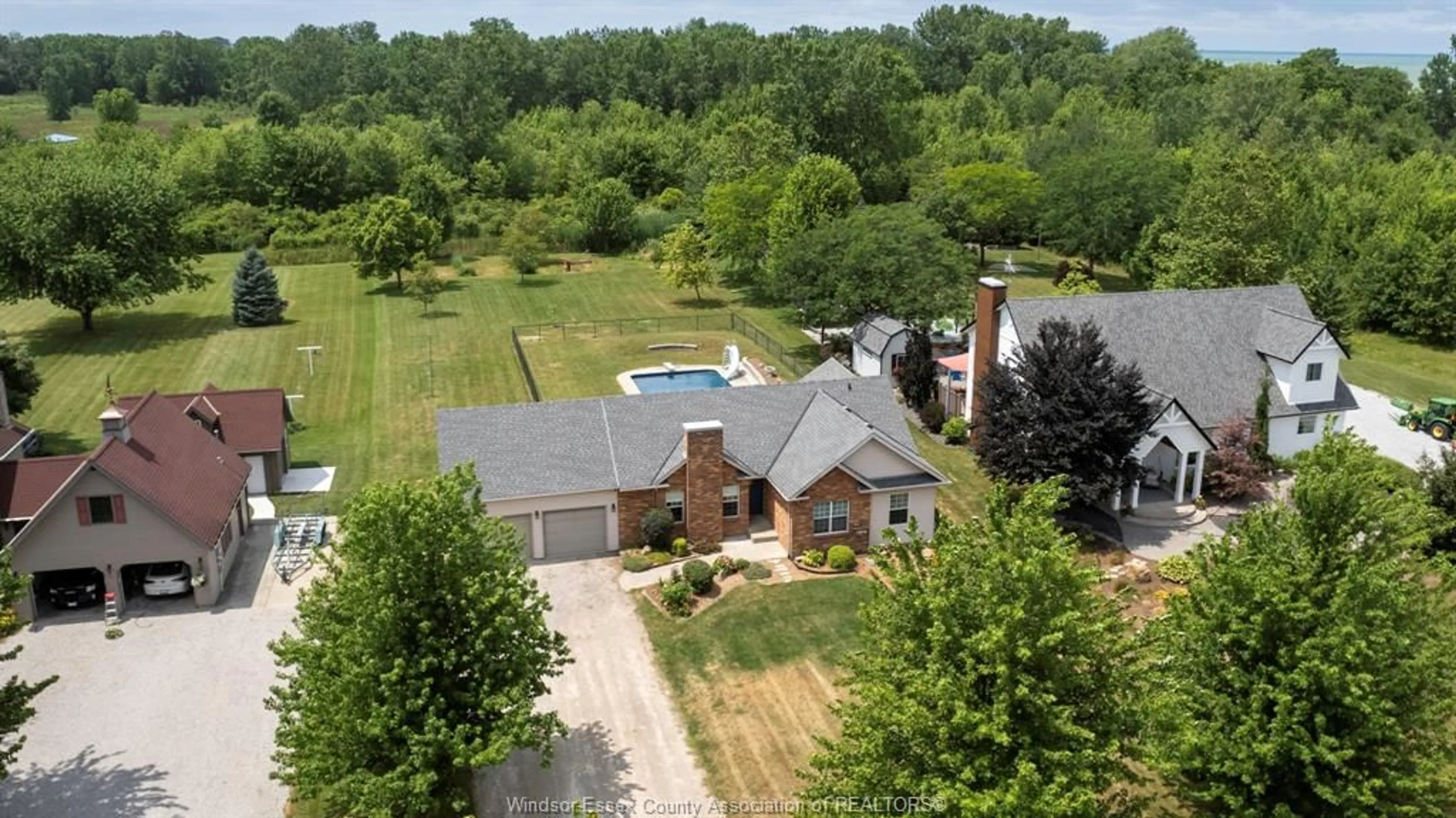 A pic from outside/outdoor area/front of a property/back of a property/a pic from drone, unknown for 121 SURF CLUB Dr, Lakeshore Ontario N0R 1S0