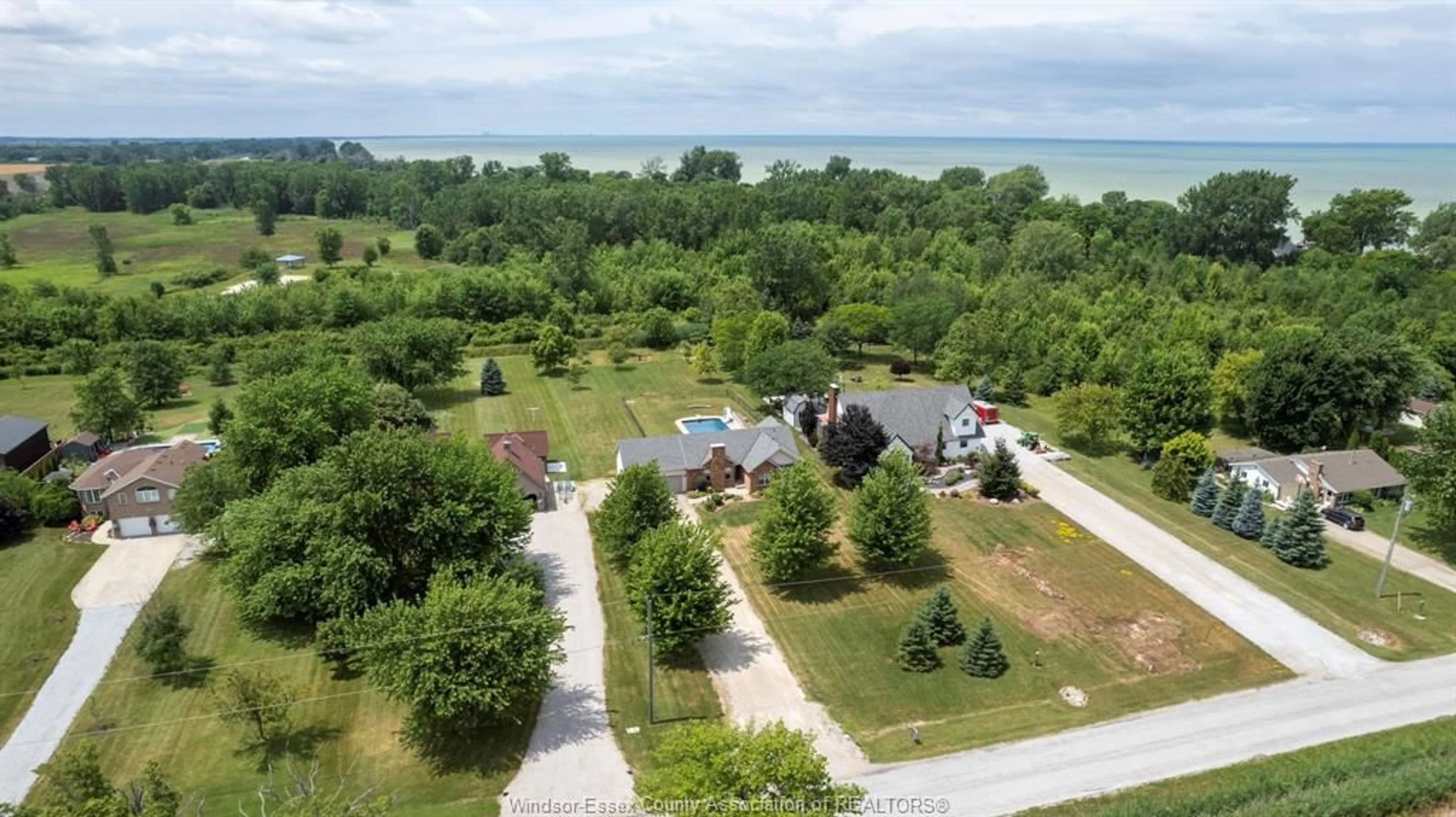 A pic from outside/outdoor area/front of a property/back of a property/a pic from drone, water/lake/river/ocean view for 121 SURF CLUB Dr, Lakeshore Ontario N0R 1S0