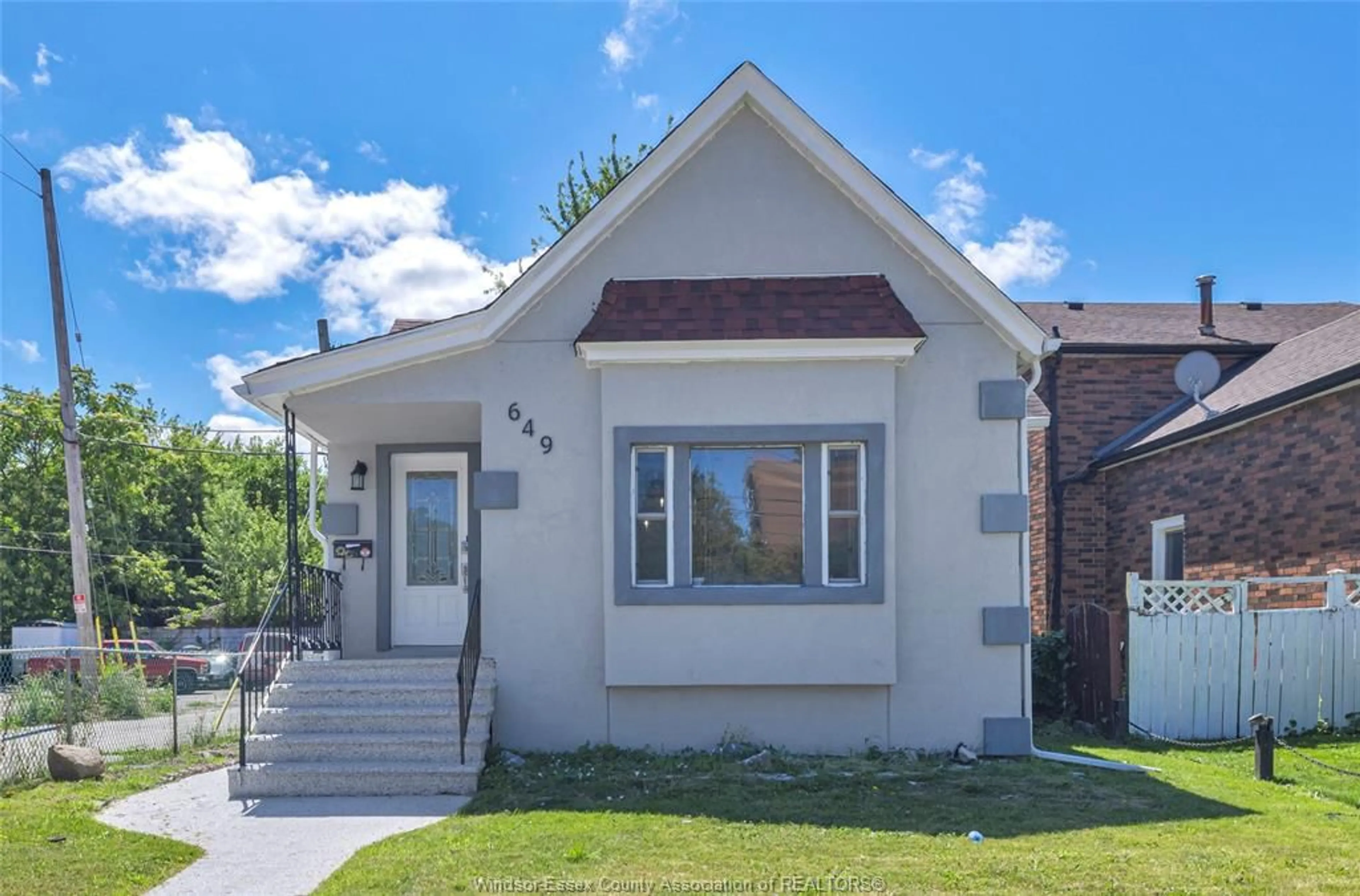 Home with brick exterior material, street for 649 CATARAQUI, Windsor Ontario N9V 3P2