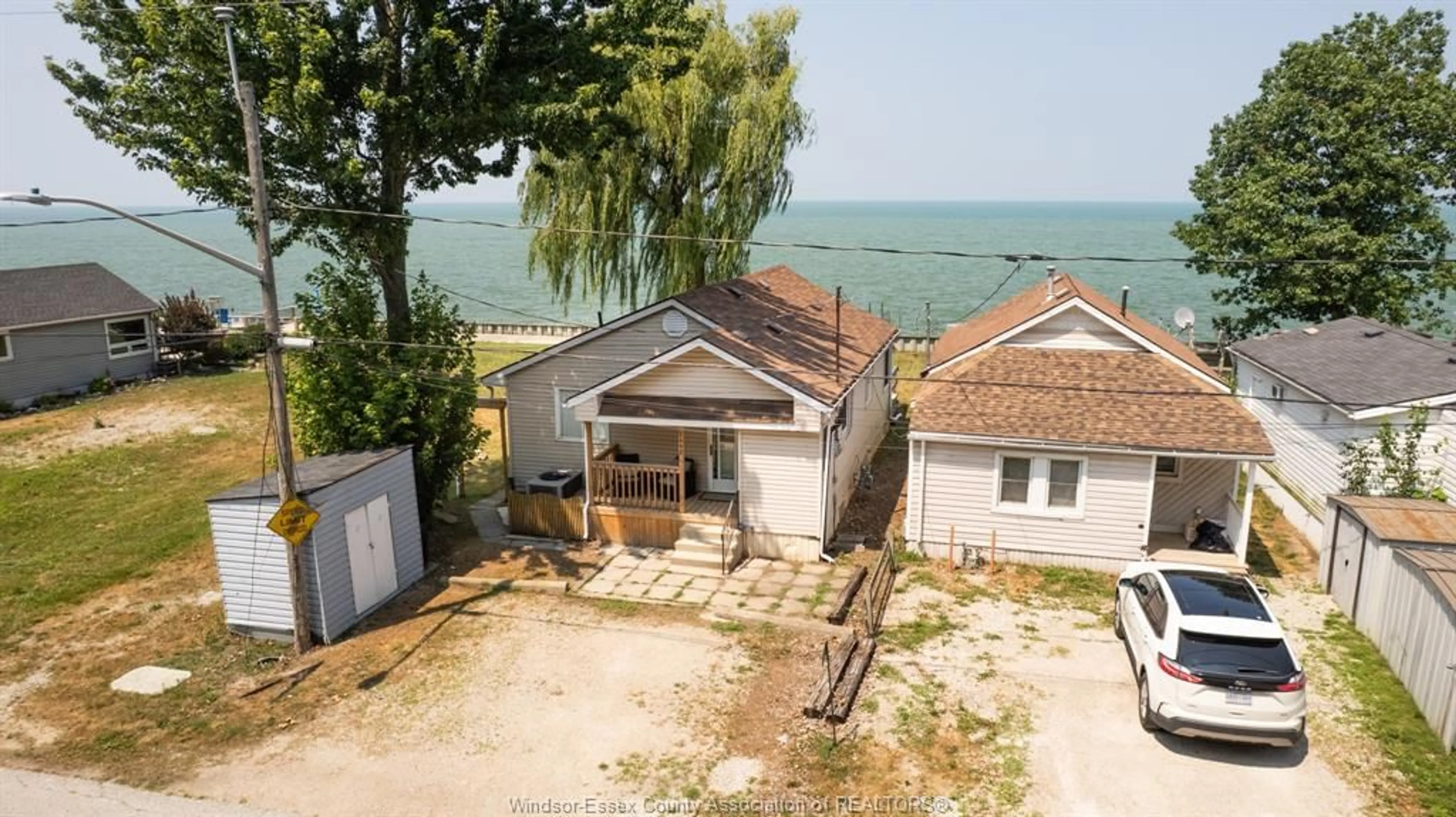 A pic from outside/outdoor area/front of a property/back of a property/a pic from drone, water/lake/river/ocean view for 1458 CAILLE Ave, Lakeshore Ontario N8L 0J2