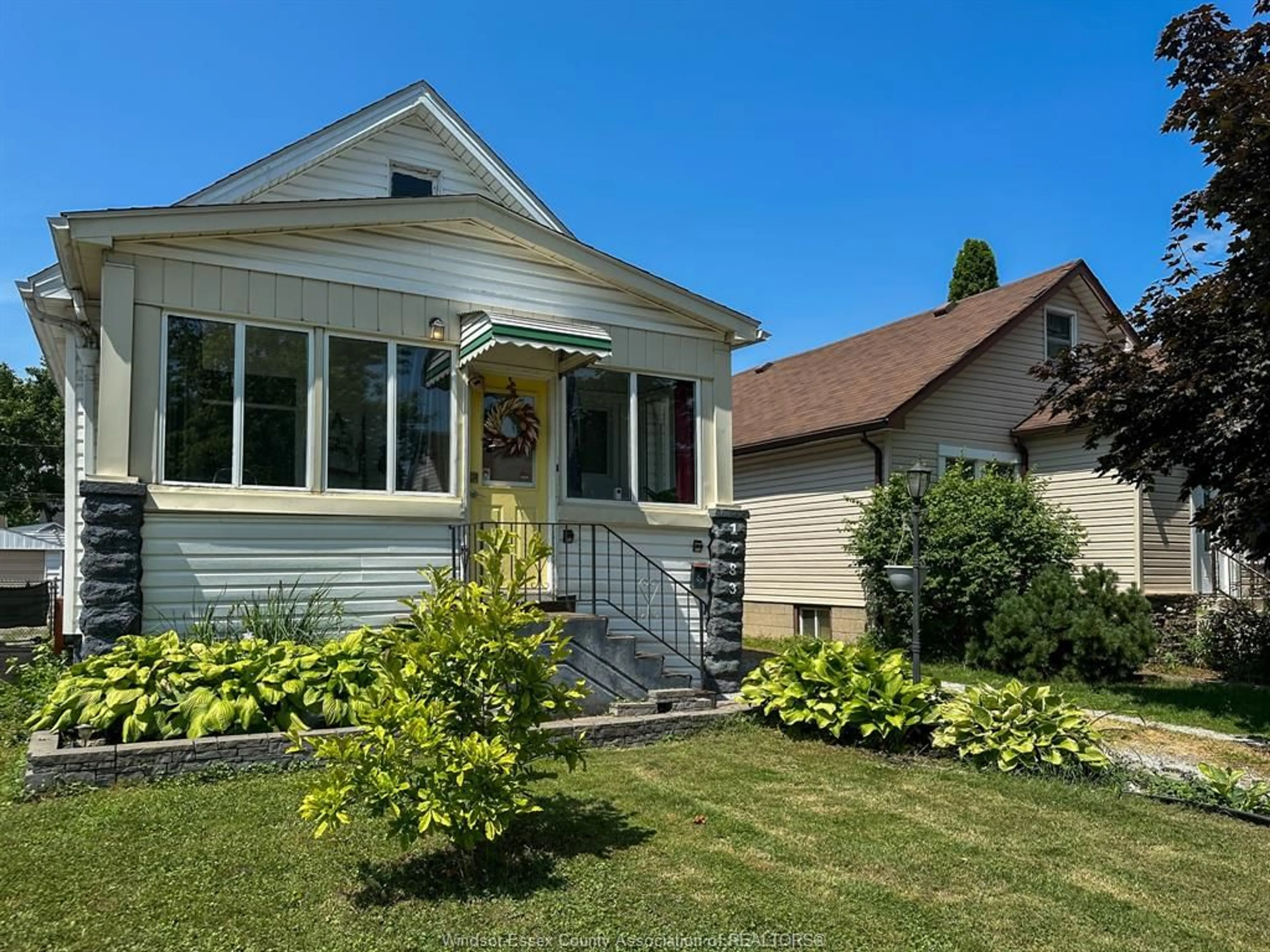 Home with vinyl exterior material, street for 1783 HALL, Windsor Ontario N8W 2L5