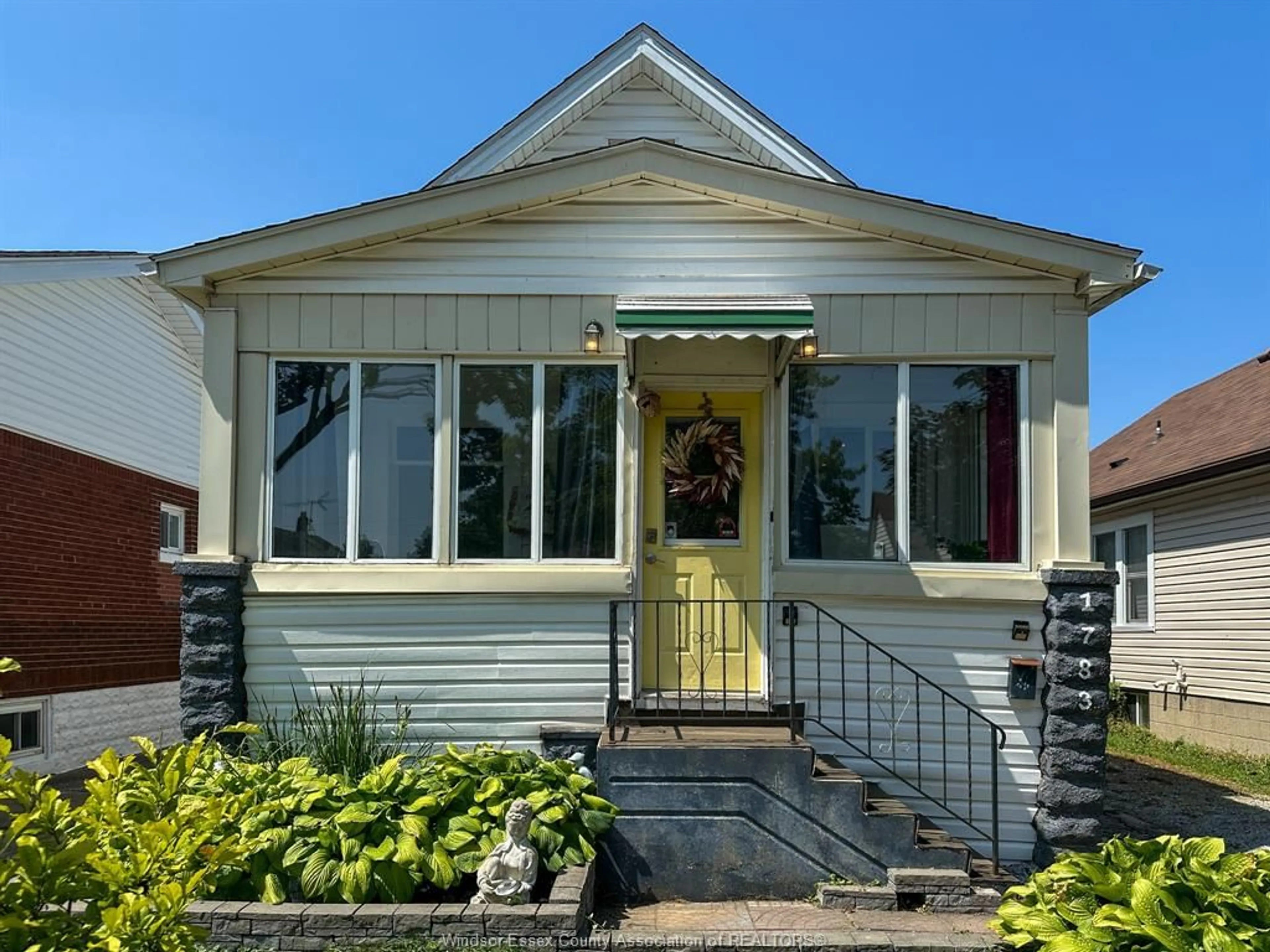 Home with vinyl exterior material, street for 1783 HALL, Windsor Ontario N8W 2L5