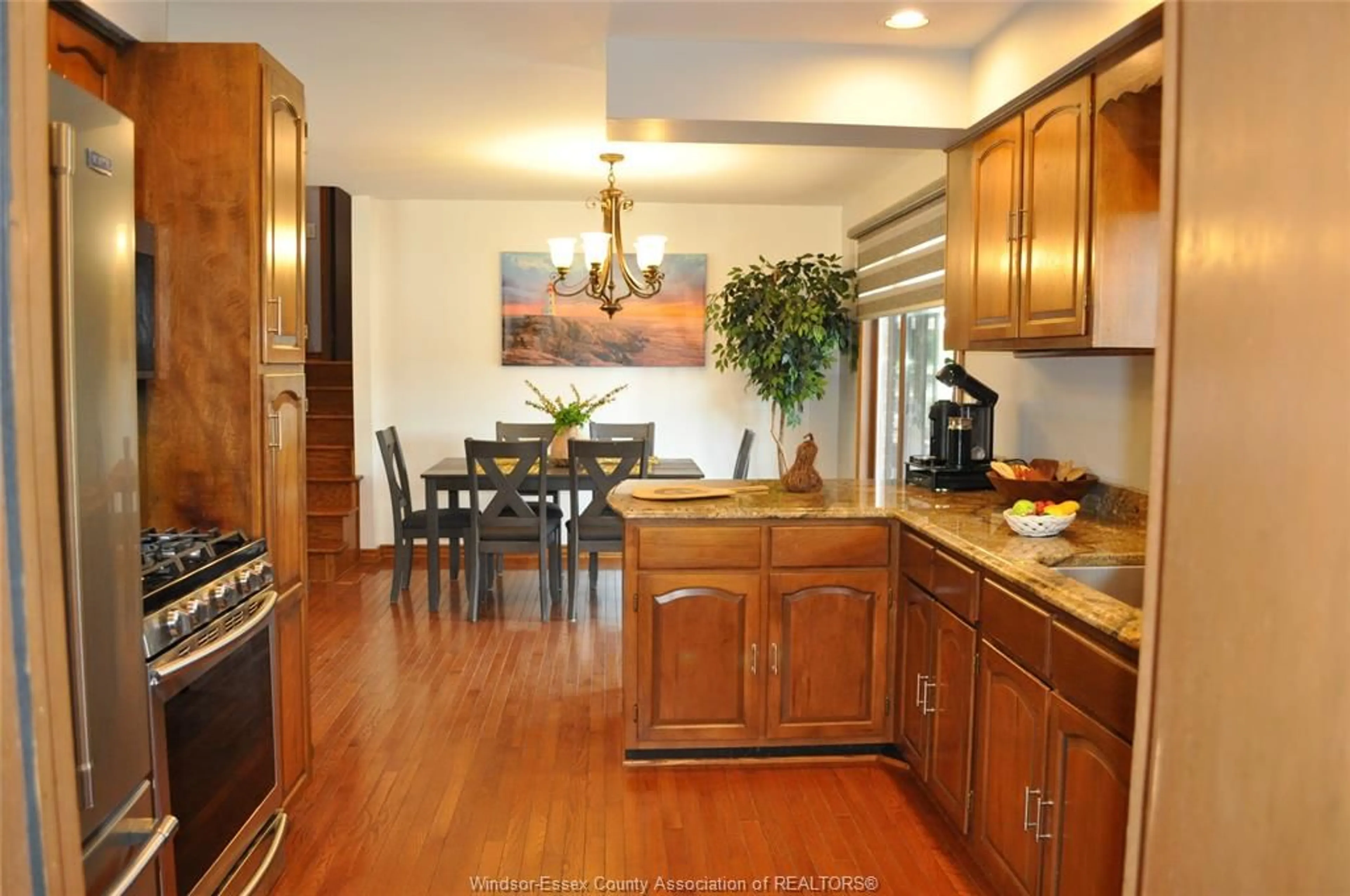Open concept kitchen, wood/laminate floor for 353 Cousineau Rd, Windsor Ontario N9G 1V6