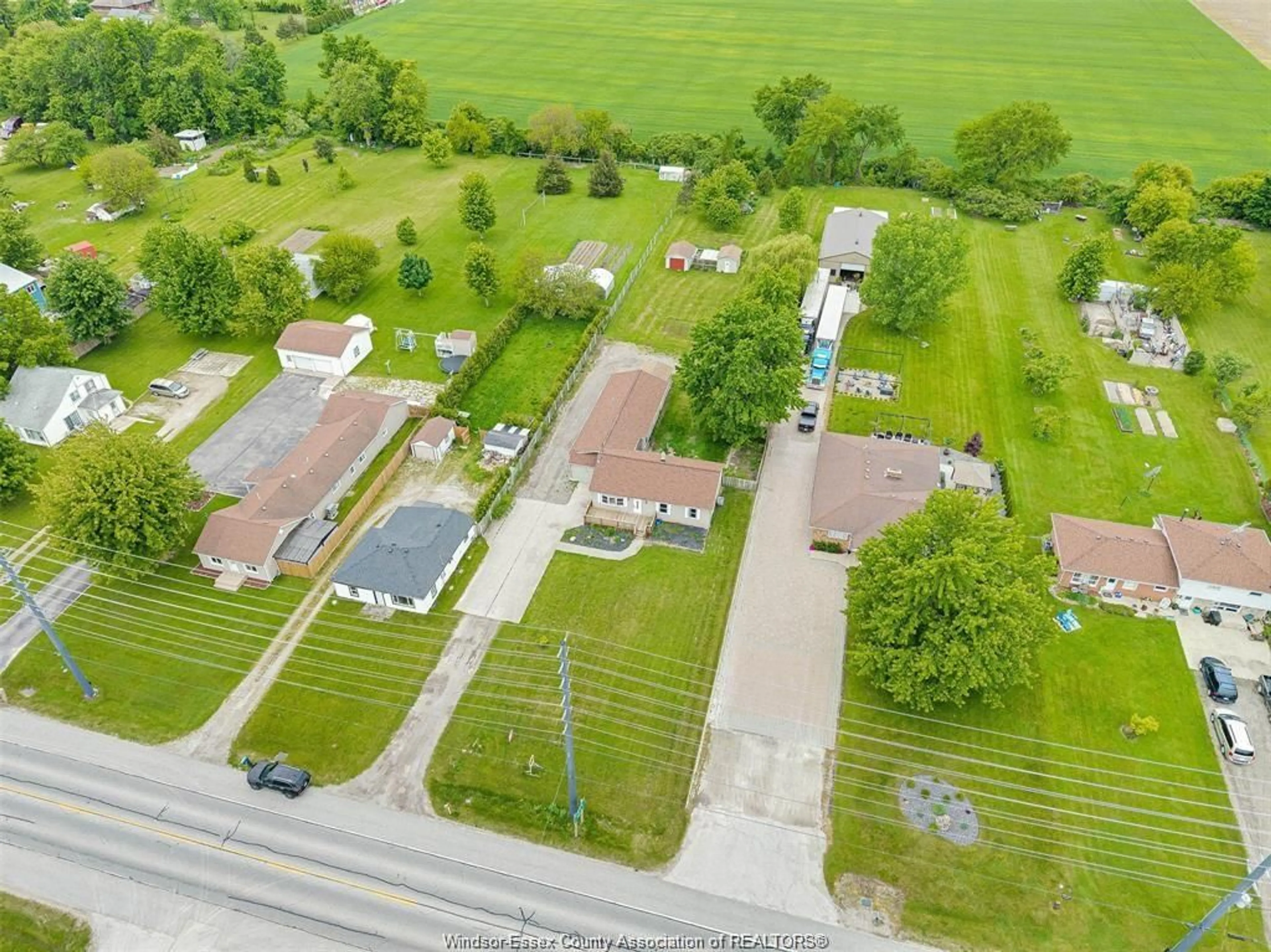 A pic from outside/outdoor area/front of a property/back of a property/a pic from drone, street for 525 HIGHWAY 77, Leamington Ontario N8H 3V8