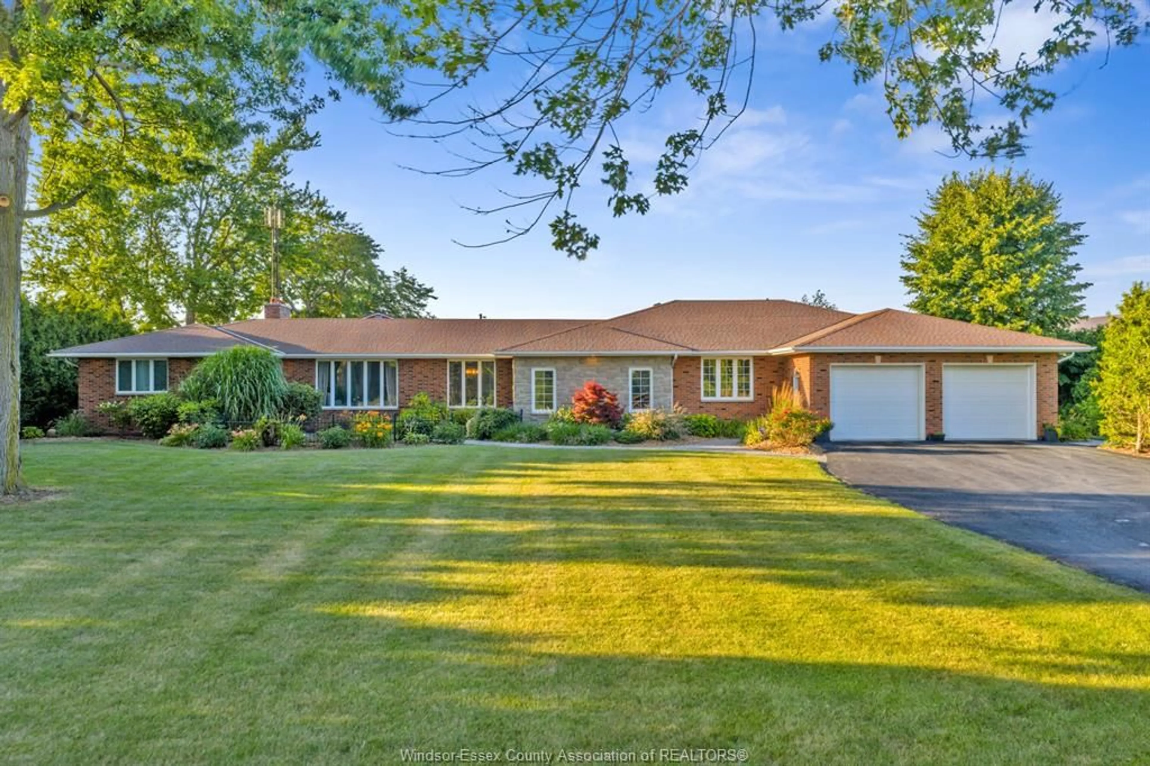 Home with brick exterior material, street for 1121 Mersea Road 1, Leamington Ontario N8H 3V4