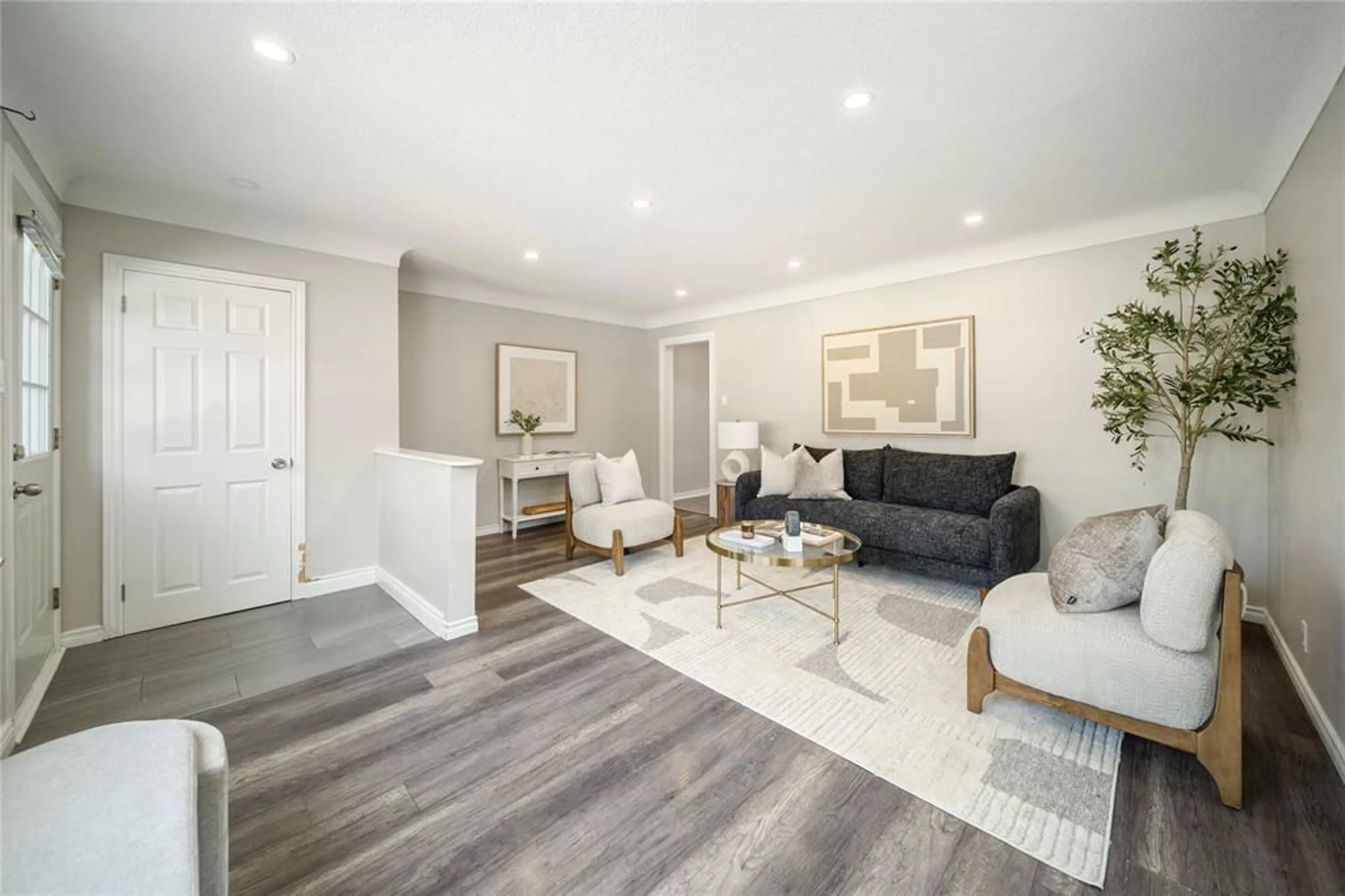 Living room with furniture, wood/laminate floor for 770 NETHERLANDS Pl, Sarnia Ontario N7S 2W4