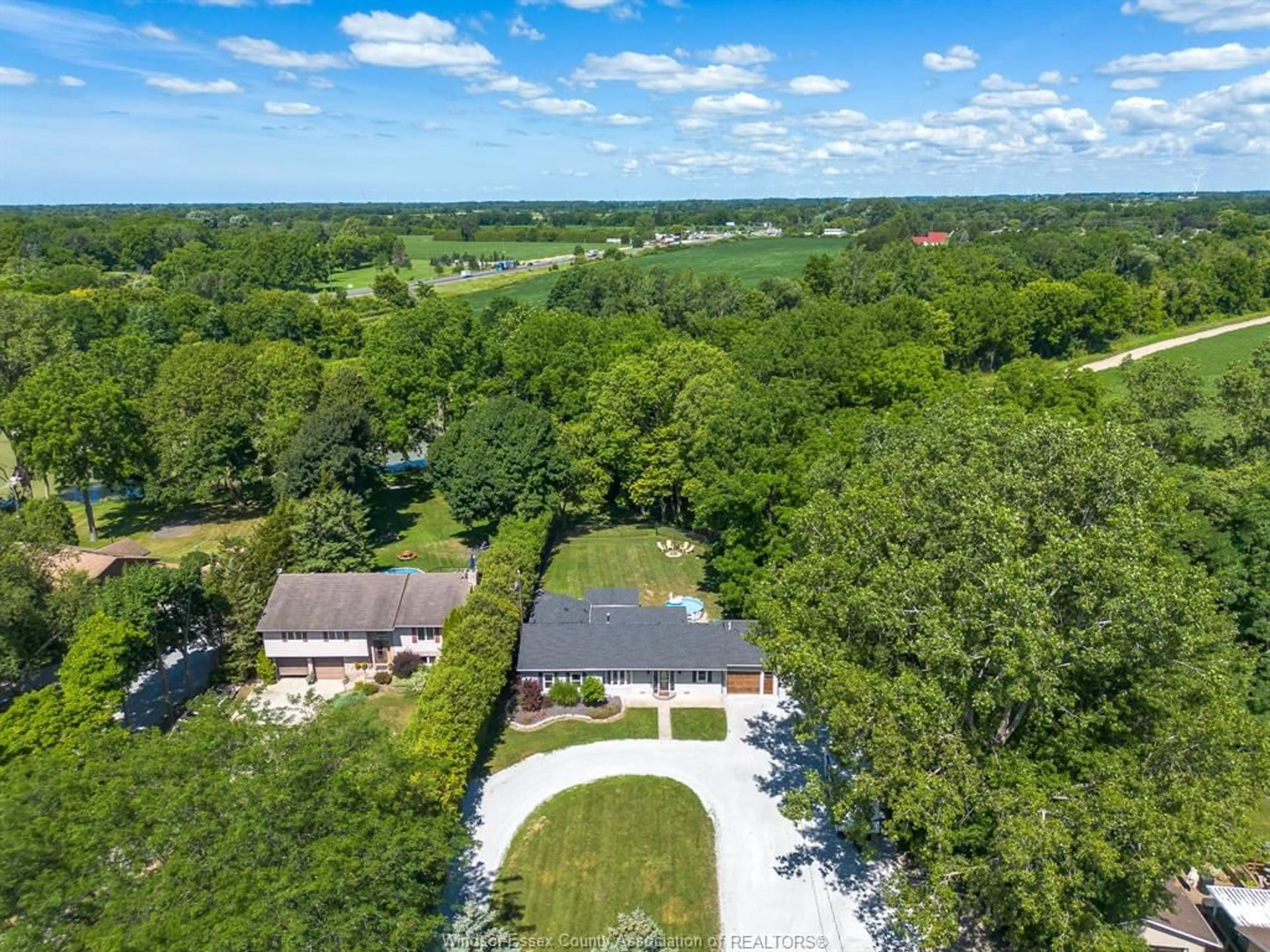 A pic from outside/outdoor area/front of a property/back of a property/a pic from drone, water/lake/river/ocean view for 9395 River Line, Chatham Ontario N7M 5J4