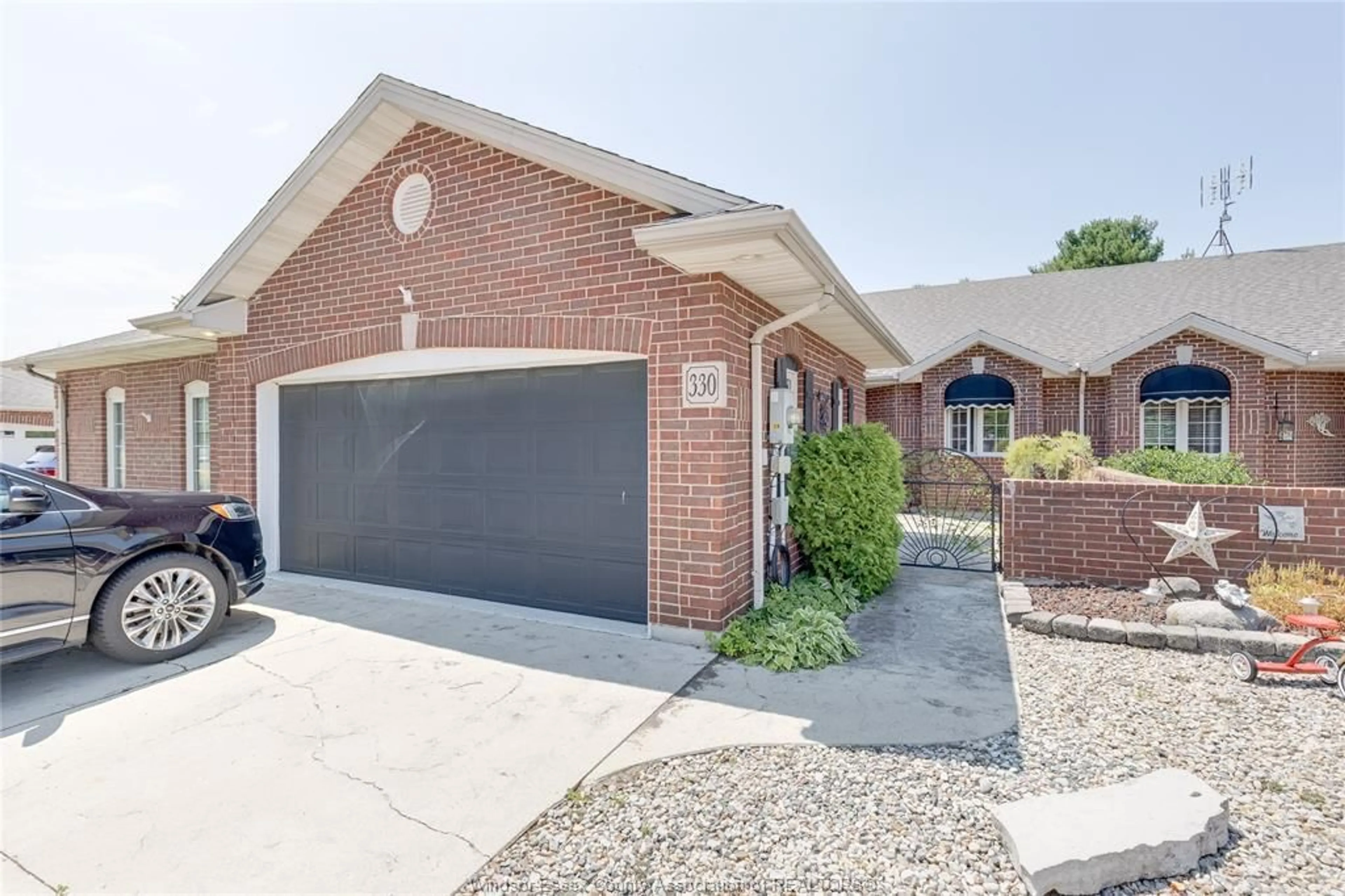 Home with brick exterior material, street for 330 SADDLE Lane, Kingsville Ontario N9Y 4A6