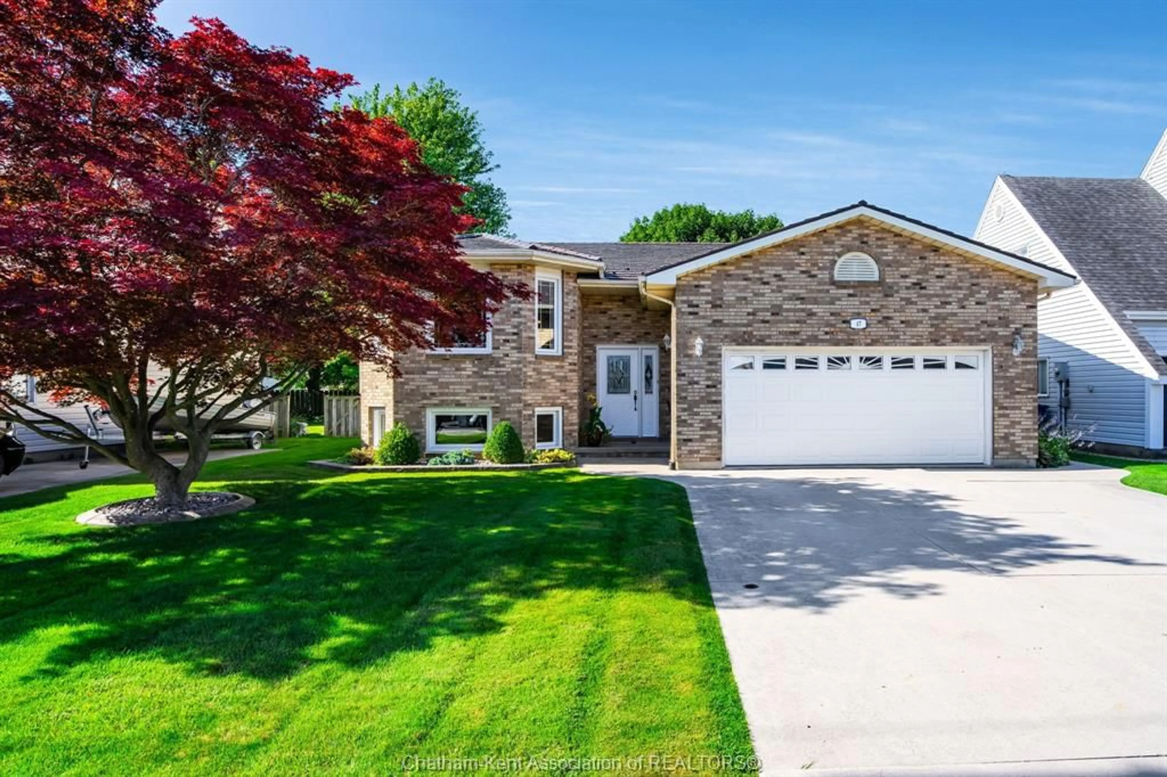 Home with brick exterior material, street for 47 McKee Rd, Wallaceburg Ontario N8A 4P9