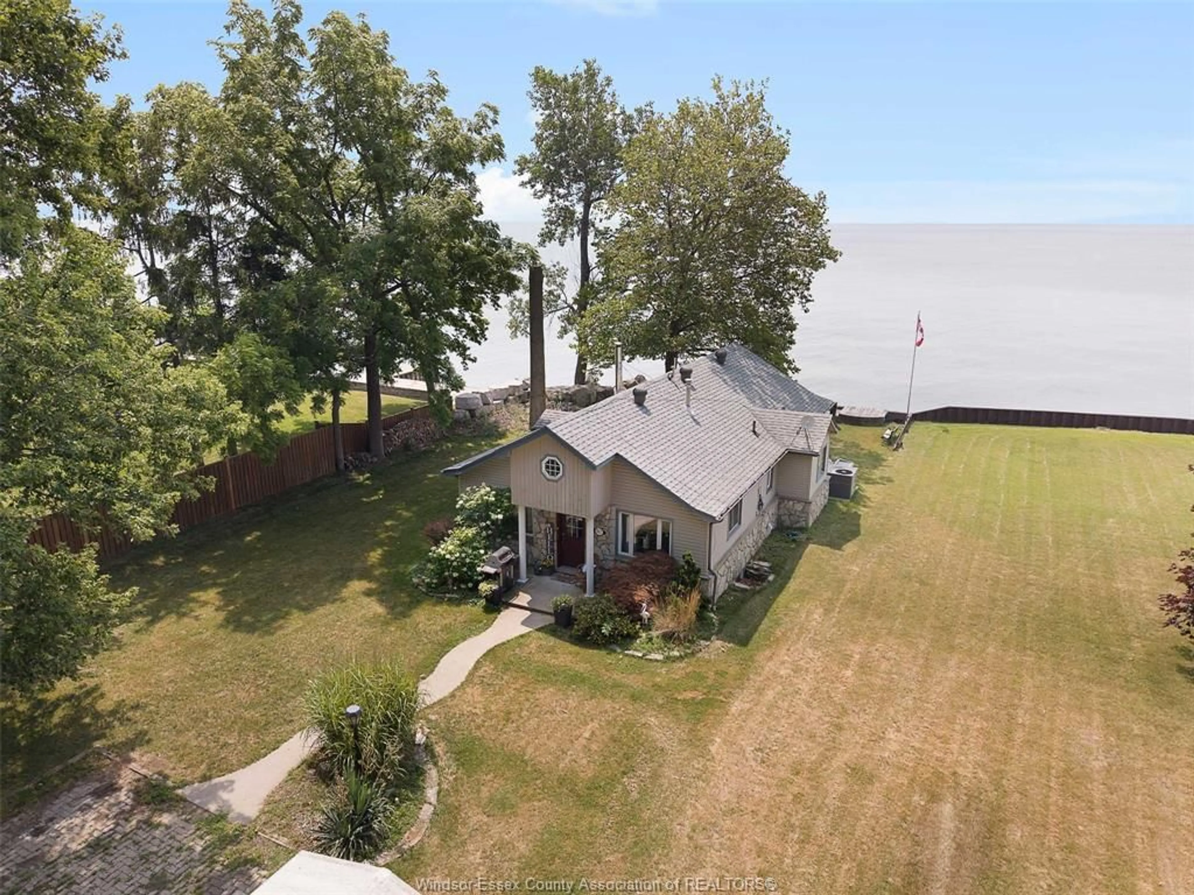 A pic from outside/outdoor area/front of a property/back of a property/a pic from drone, water/lake/river/ocean view for 937 ILER BEACH ROAD, Harrow Ontario N0R 1G0
