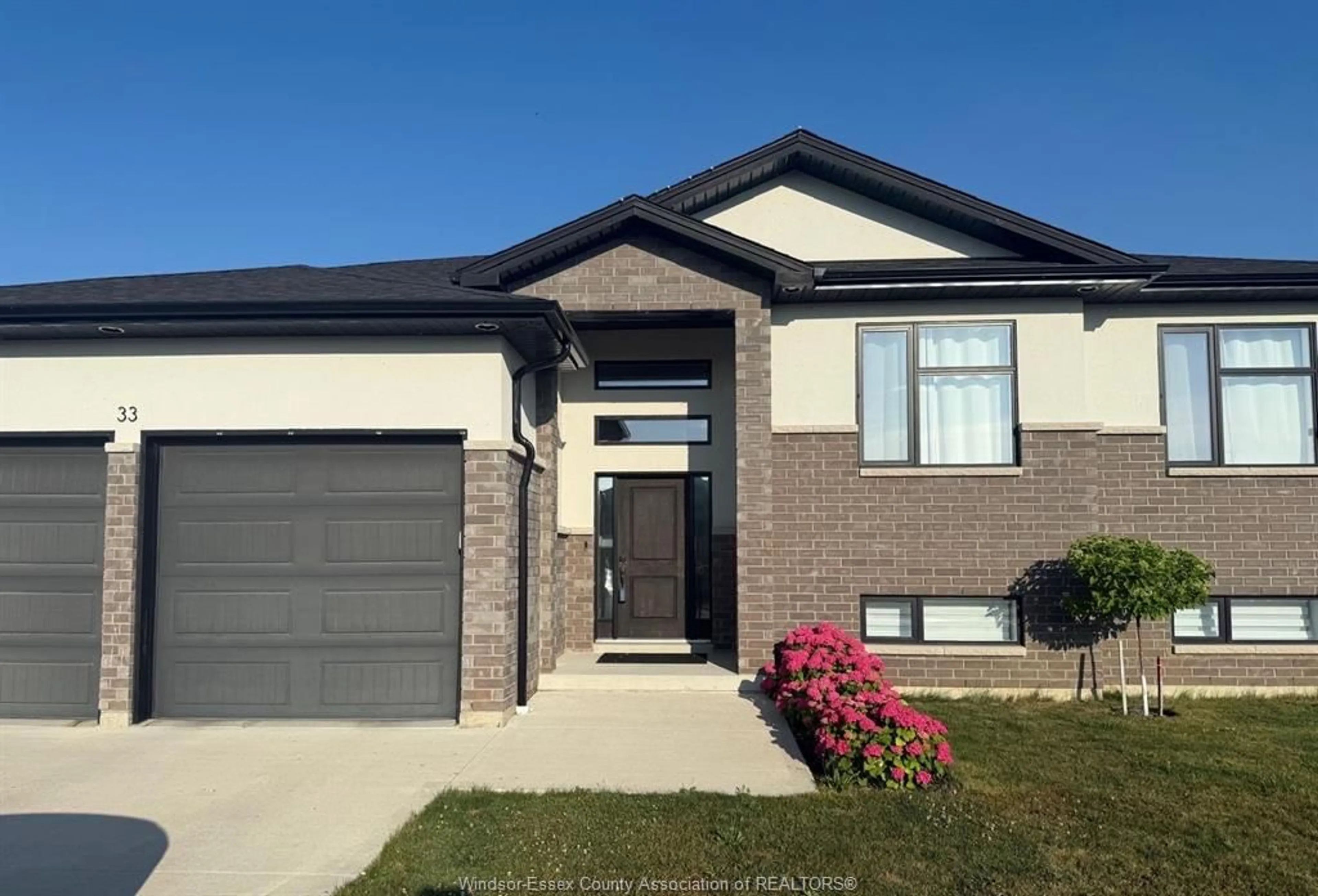Home with brick exterior material, street for 33 SUNNINGDALE Dr, Leamington Ontario N8H 0C4