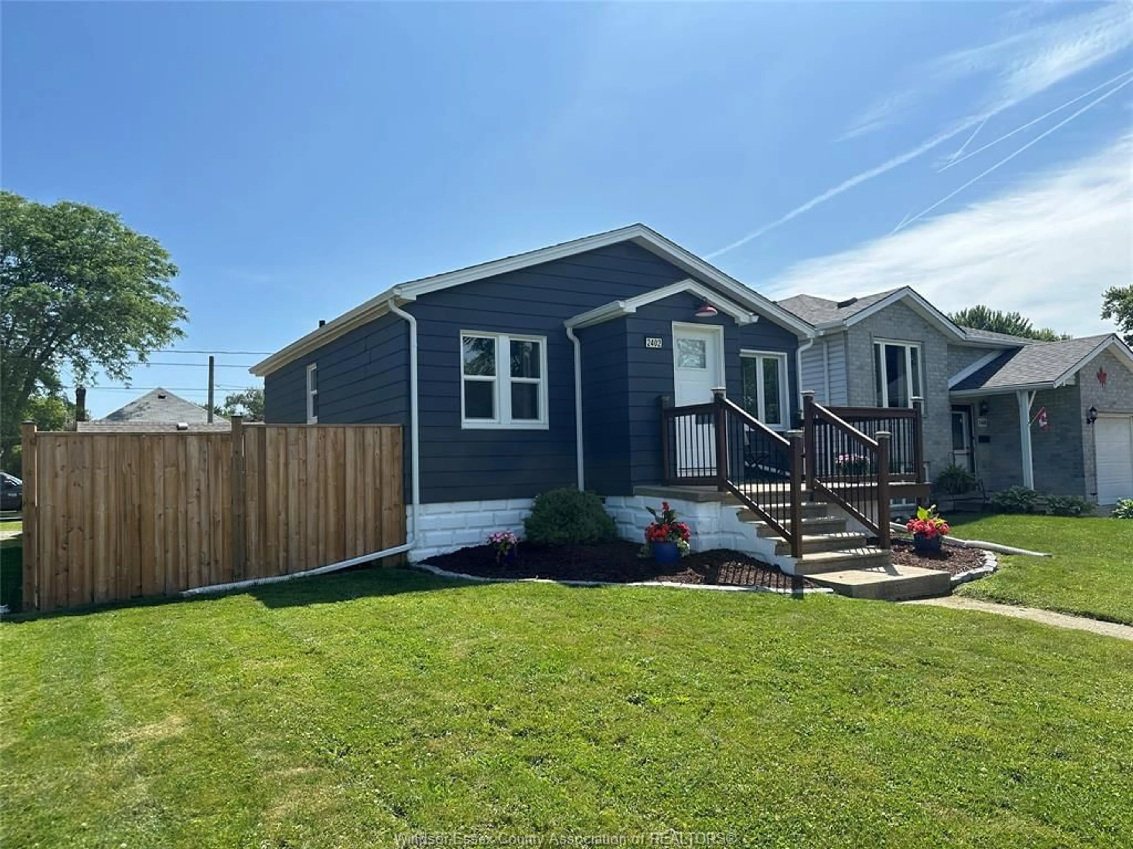 Home with vinyl exterior material, street for 2402 TOURANGEAU, Windsor Ontario N8W 4N7