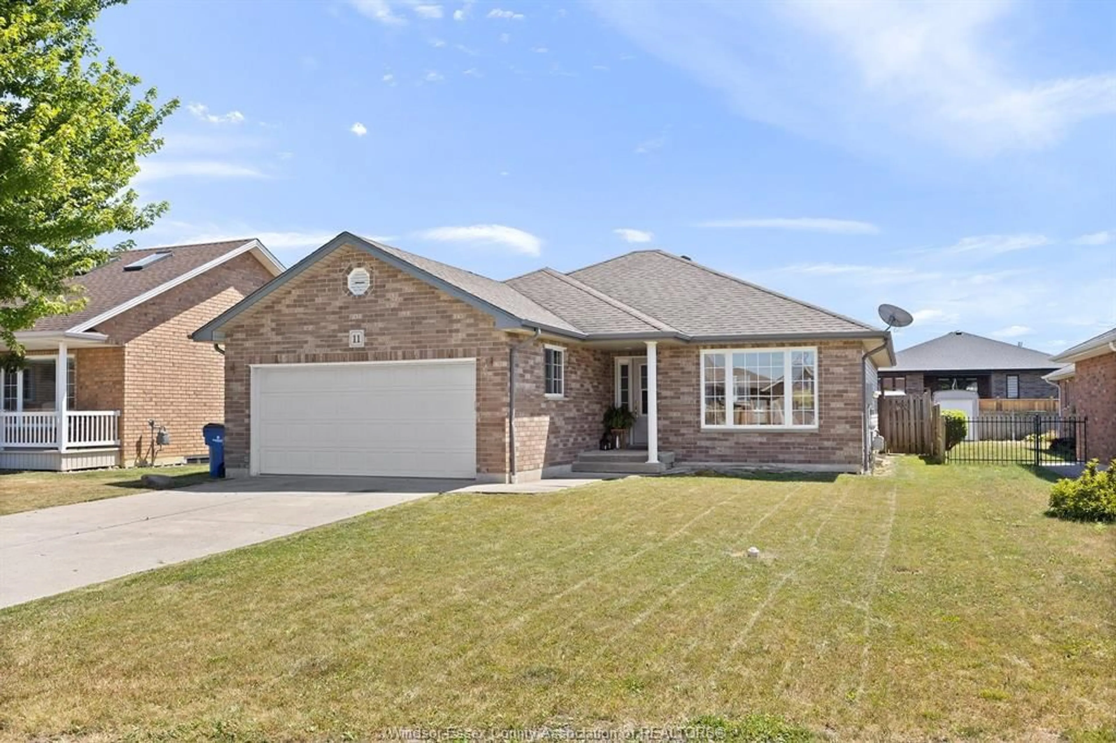 Home with brick exterior material, street for 11 HOMESTEADS Dr, Tilbury Ontario N0P 2L0
