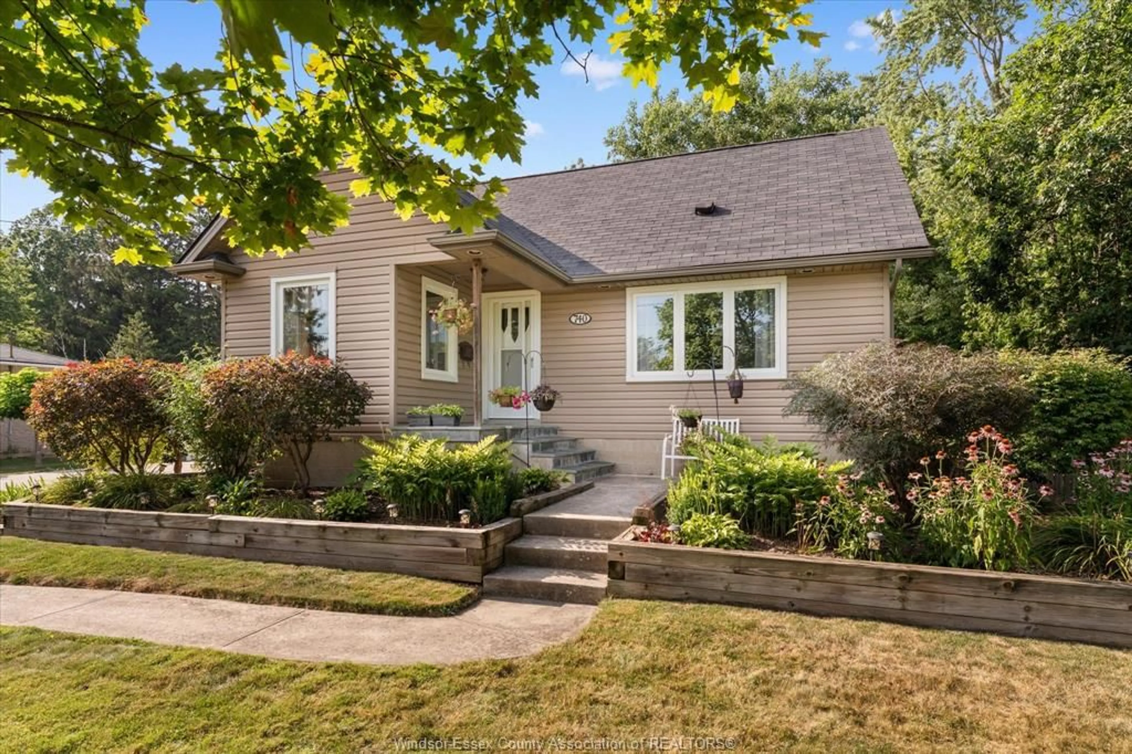Home with brick exterior material, street for 740 COUSINEAU Rd, Windsor Ontario N9G 1V7