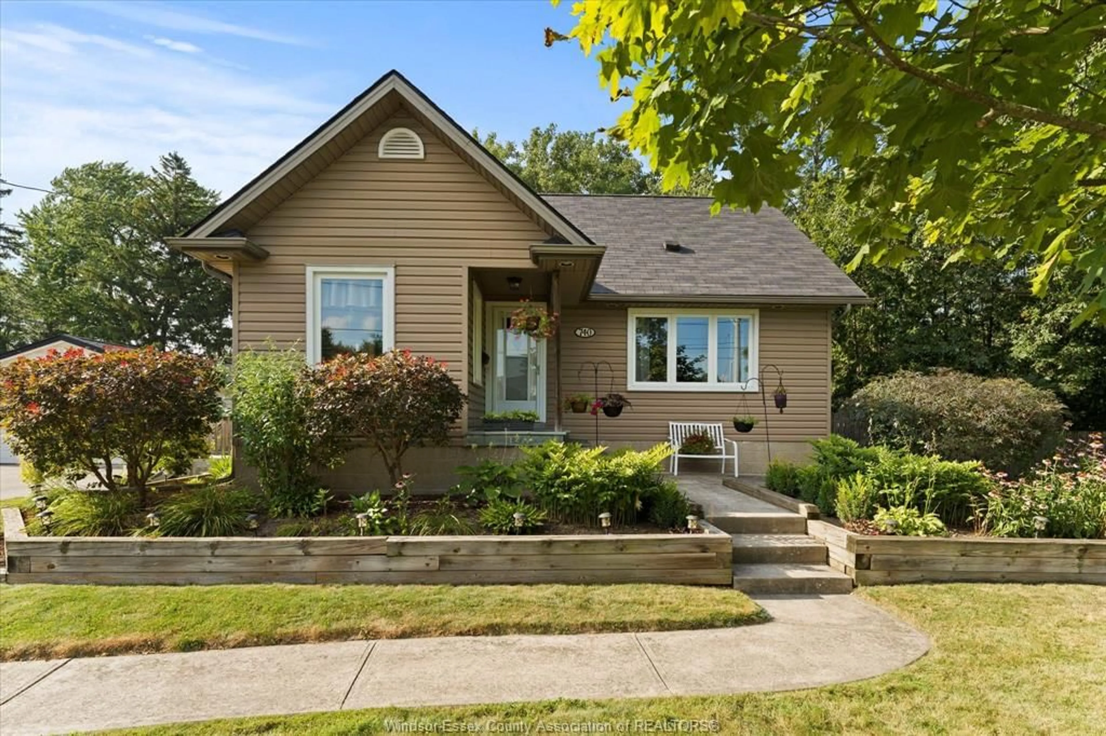 Home with brick exterior material, street for 740 COUSINEAU Rd, Windsor Ontario N9G 1V7
