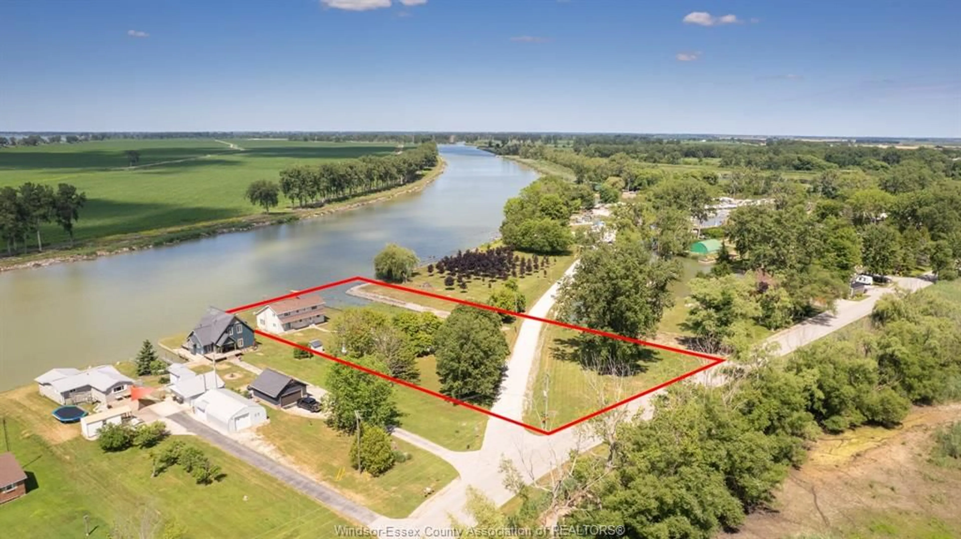 A pic from outside/outdoor area/front of a property/back of a property/a pic from drone, water/lake/river/ocean view for 21240 DOCKSIDE Rd, Tilbury North Ontario N0P 1L0