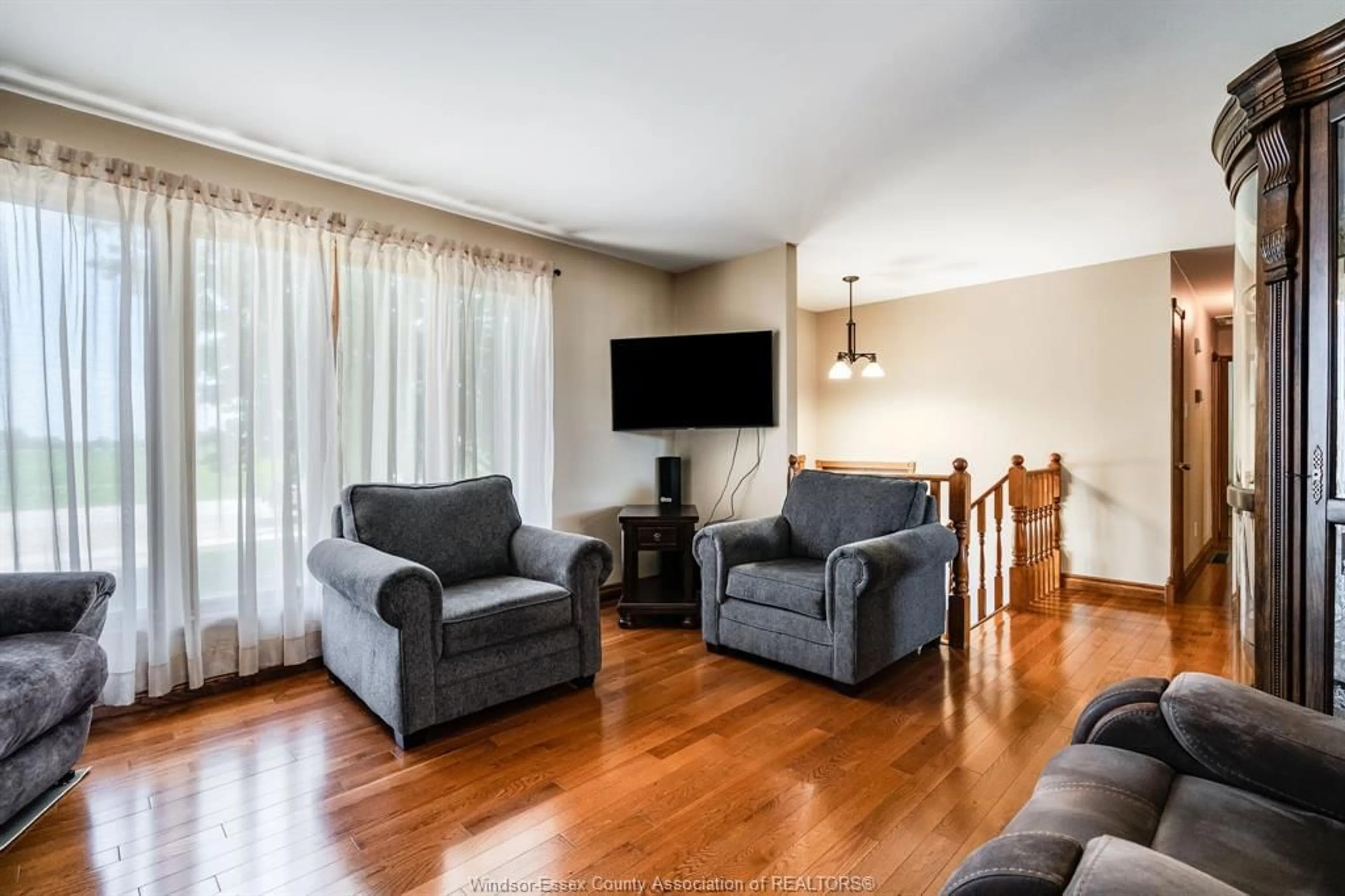 Living room with furniture, wood/laminate floor for 6108 COUNTY RD 46, Lakeshore Ontario N0P 1J0