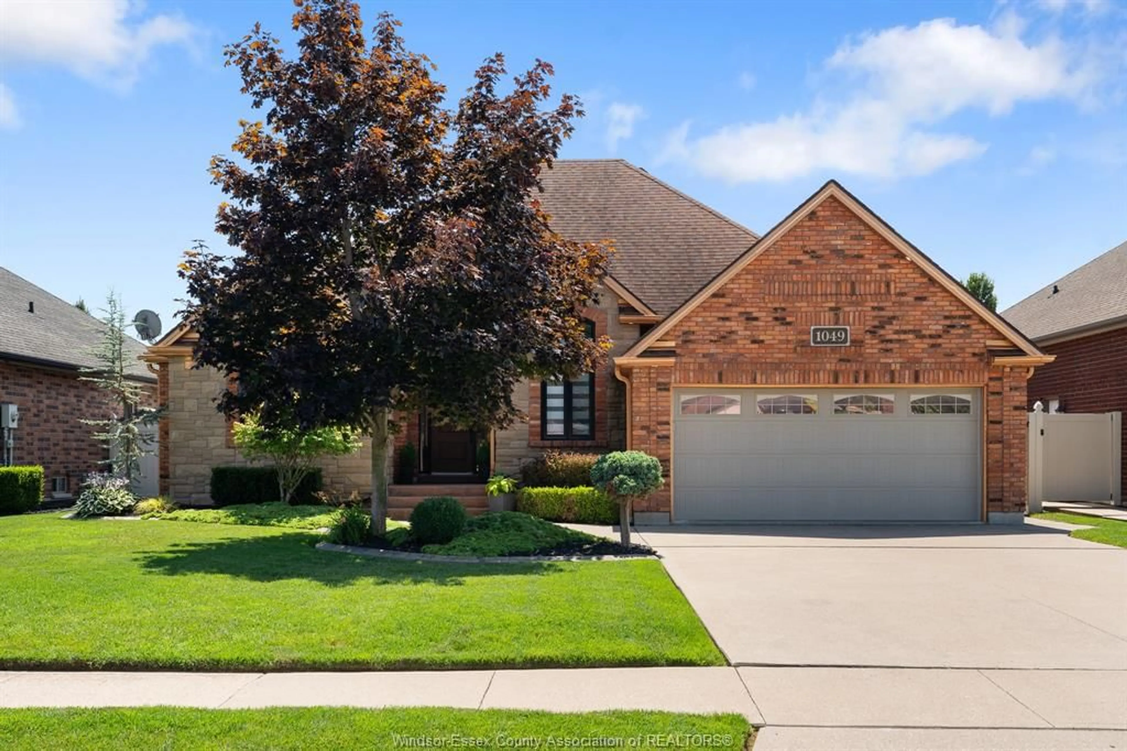 Home with brick exterior material, street for 1049 WOODLAND, Lakeshore Ontario N0R 1A0