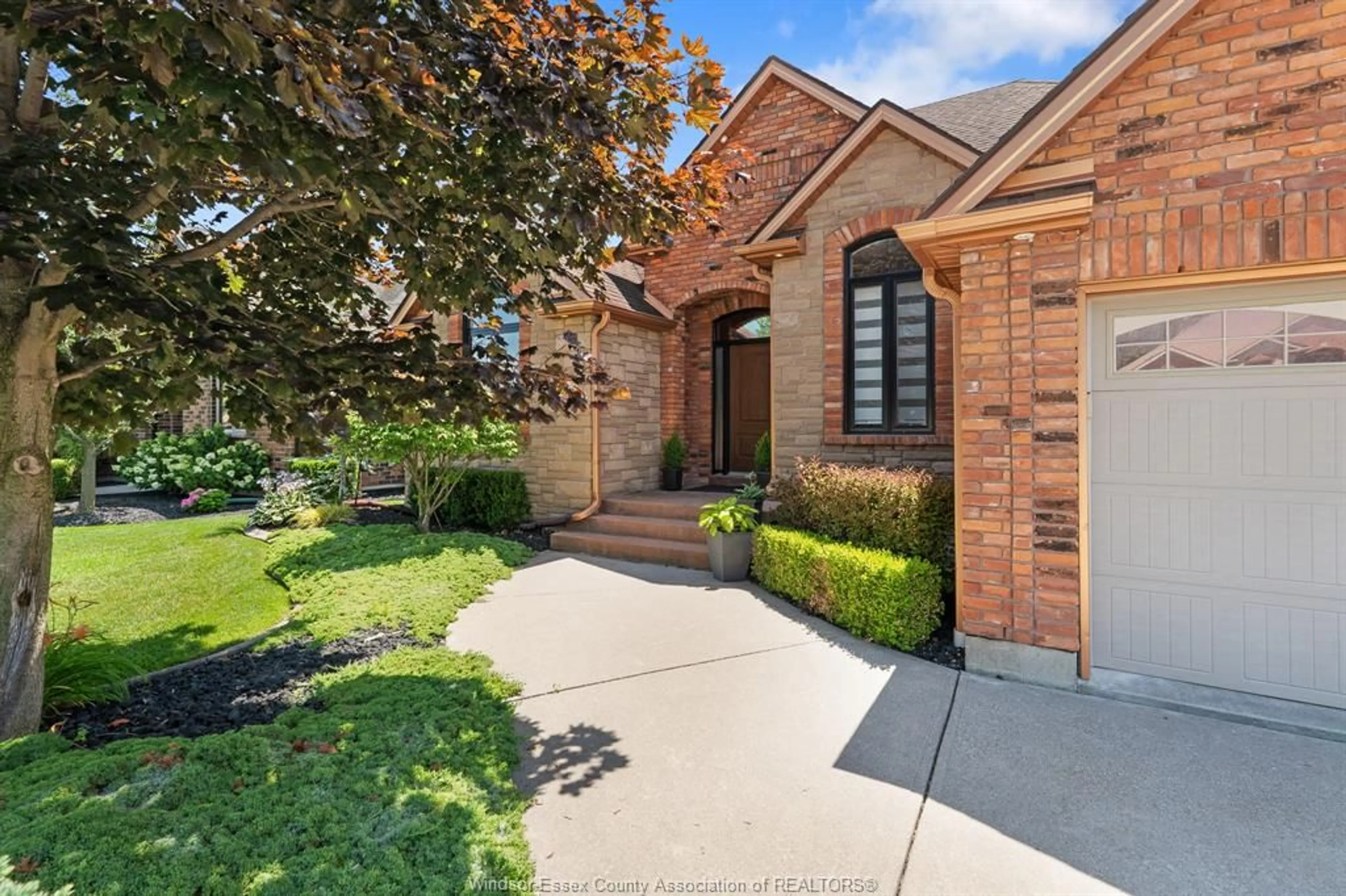 Home with brick exterior material, street for 1049 WOODLAND, Lakeshore Ontario N0R 1A0