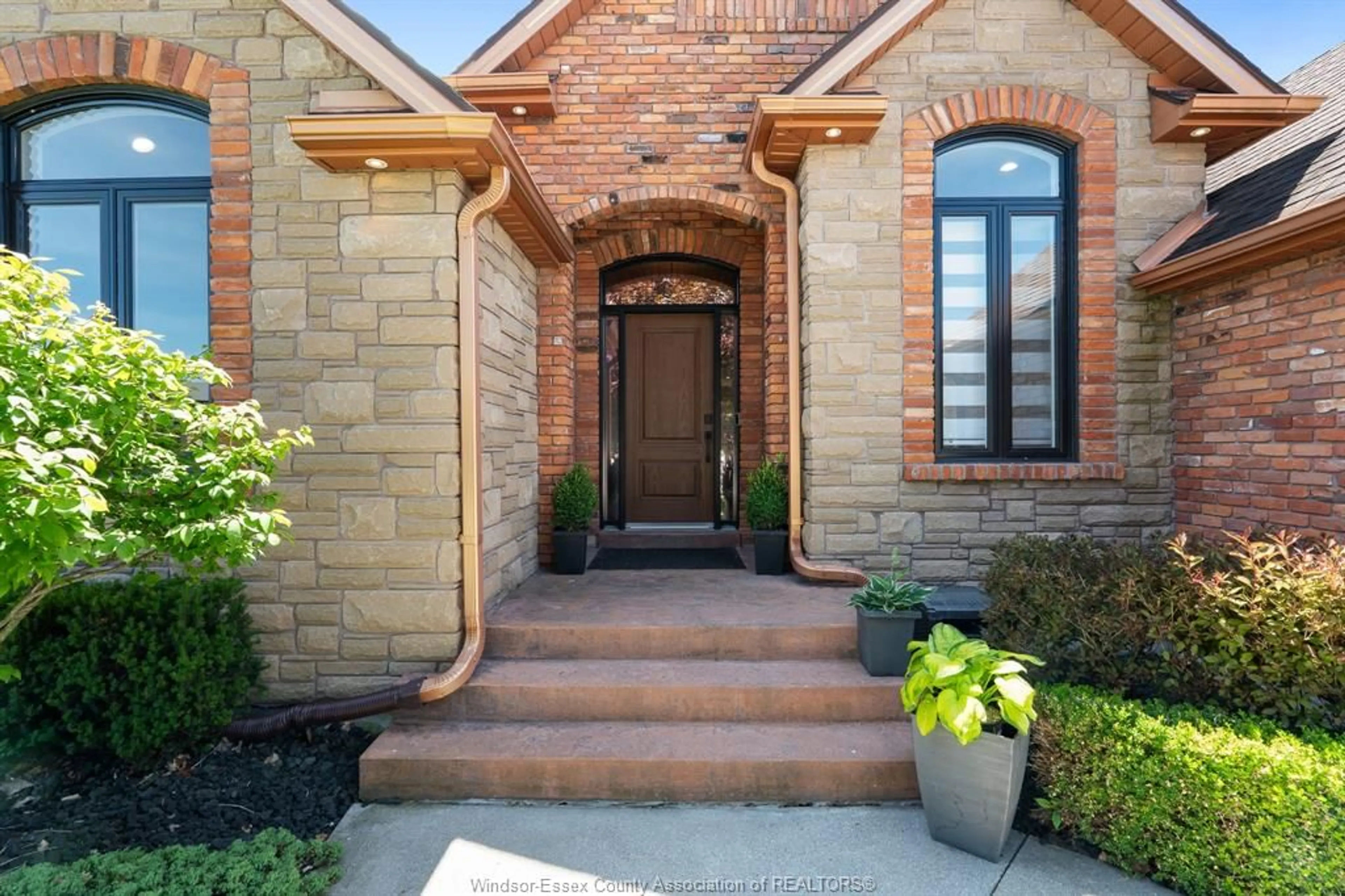 Home with brick exterior material, street for 1049 WOODLAND, Lakeshore Ontario N0R 1A0
